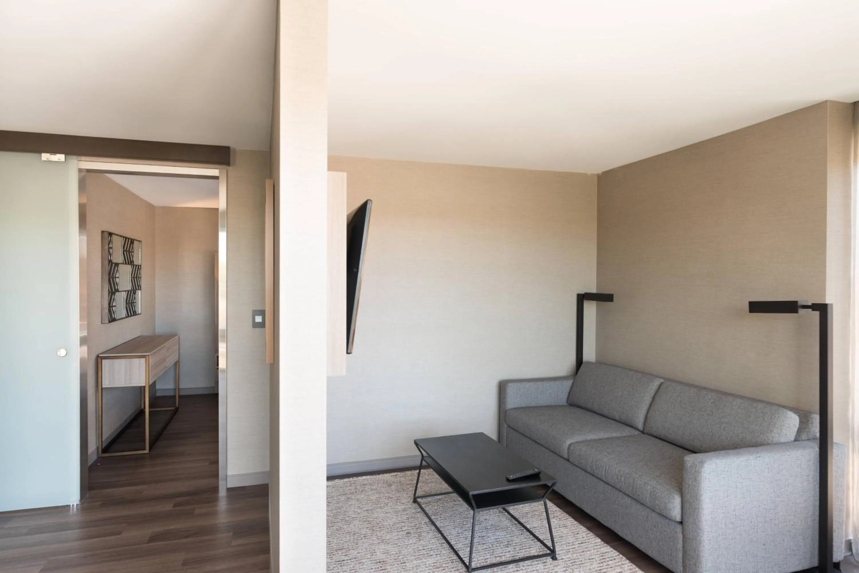 Living room in AC Hotel by Marriott Boston Cleveland Circle