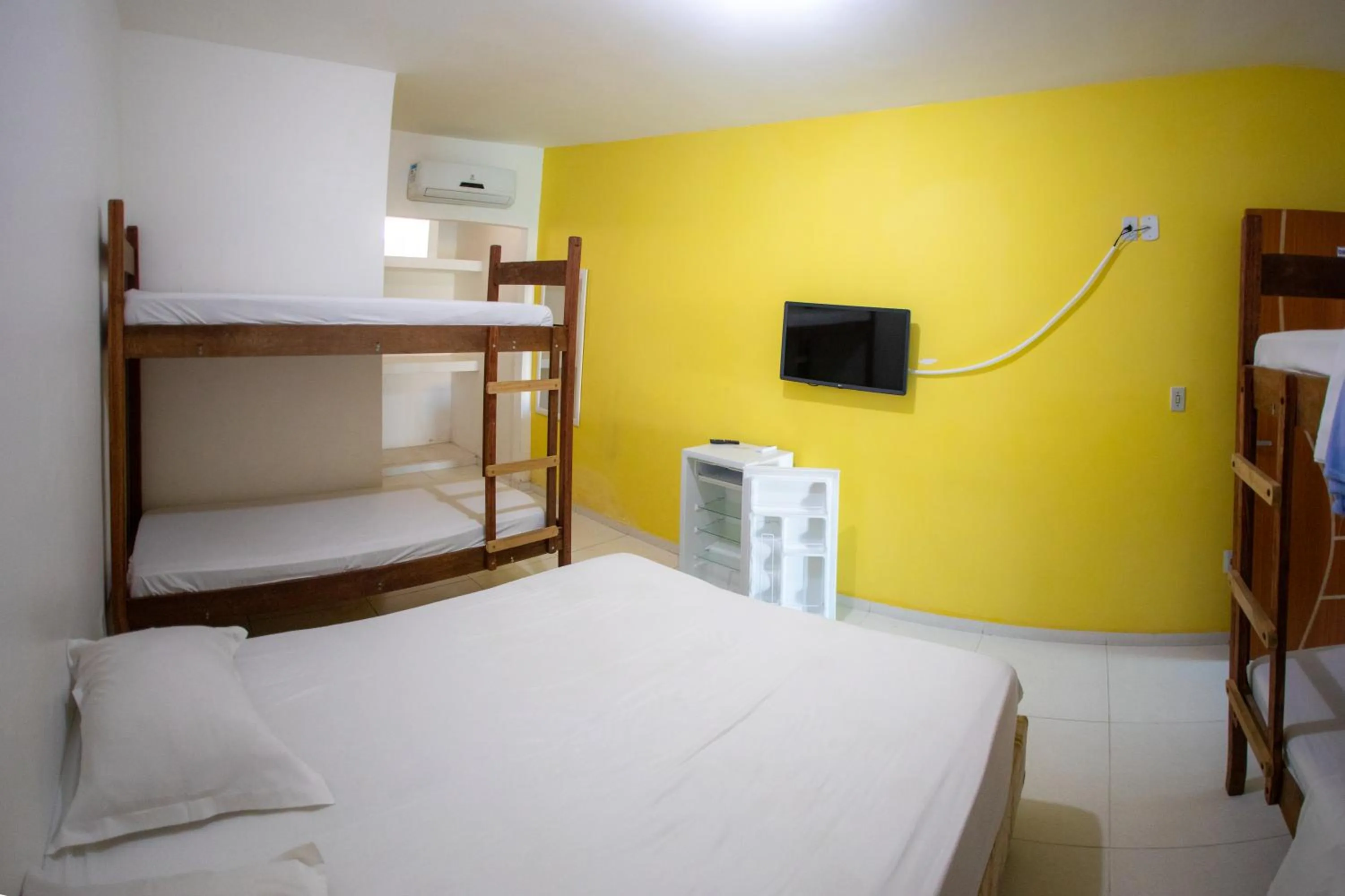 Bed in Xodó do Peró Suítes