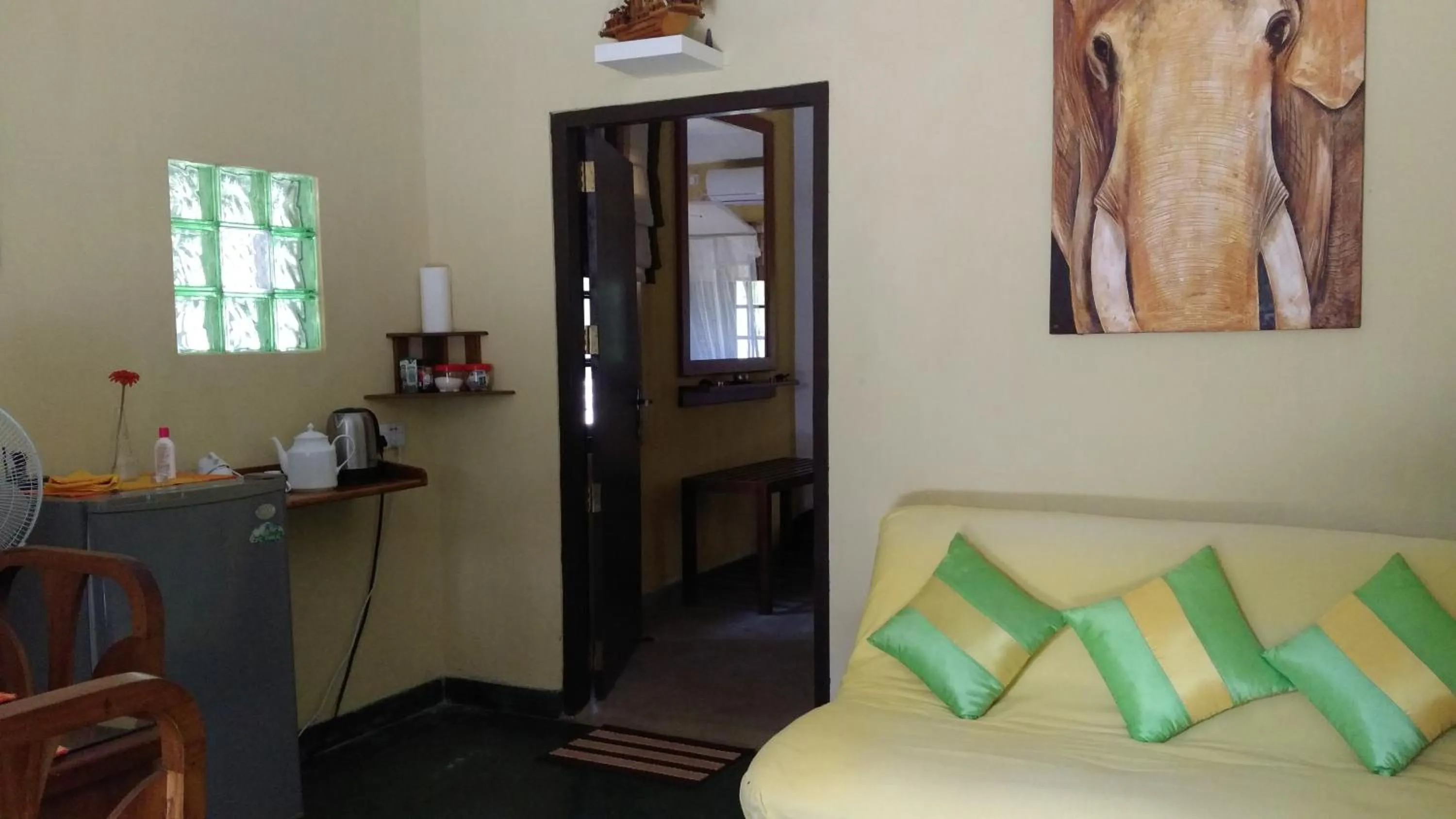 Seating area, Bed in Majestic Beach Retreat