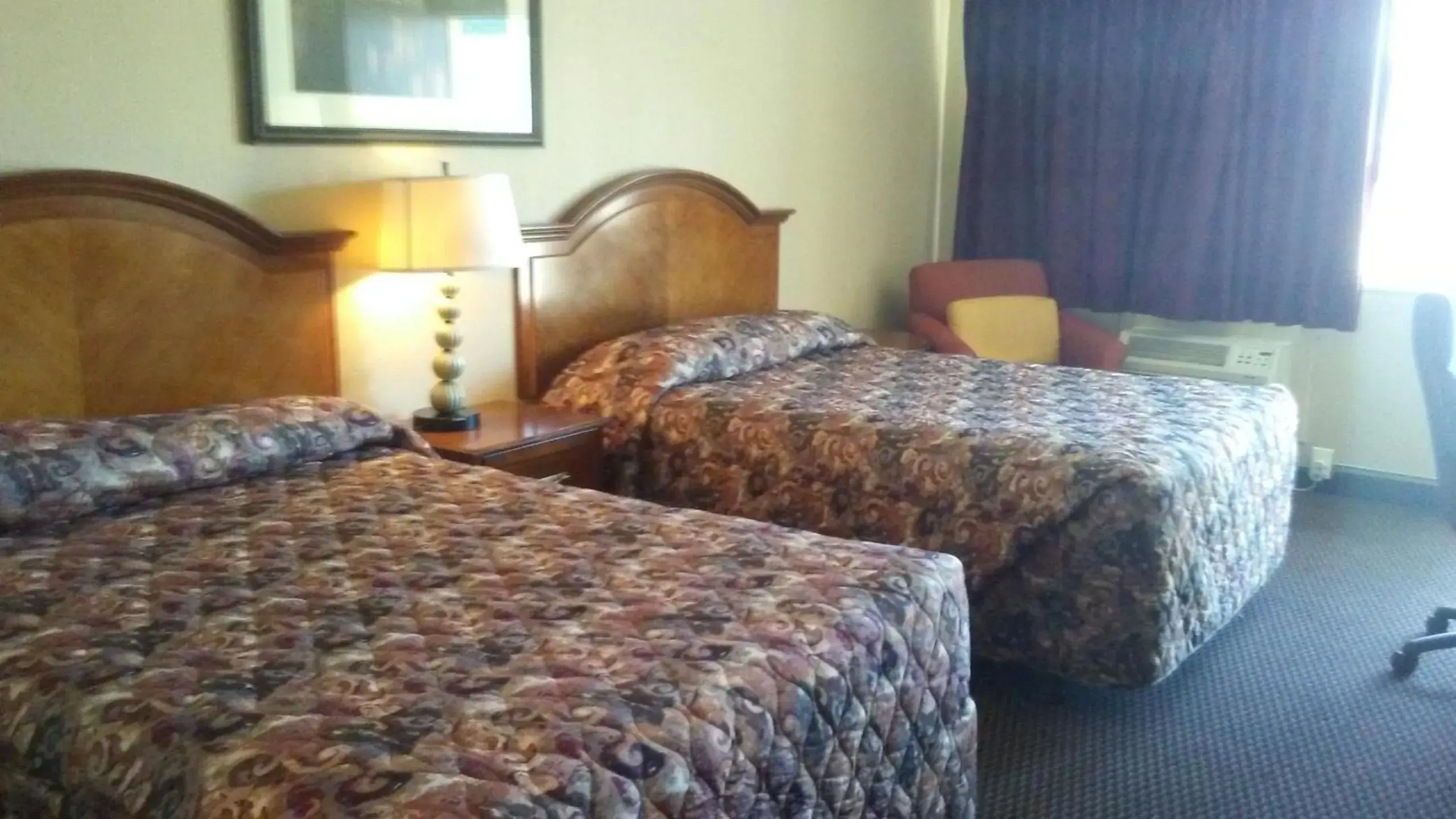 Bed in Cedars Inn Lewiston