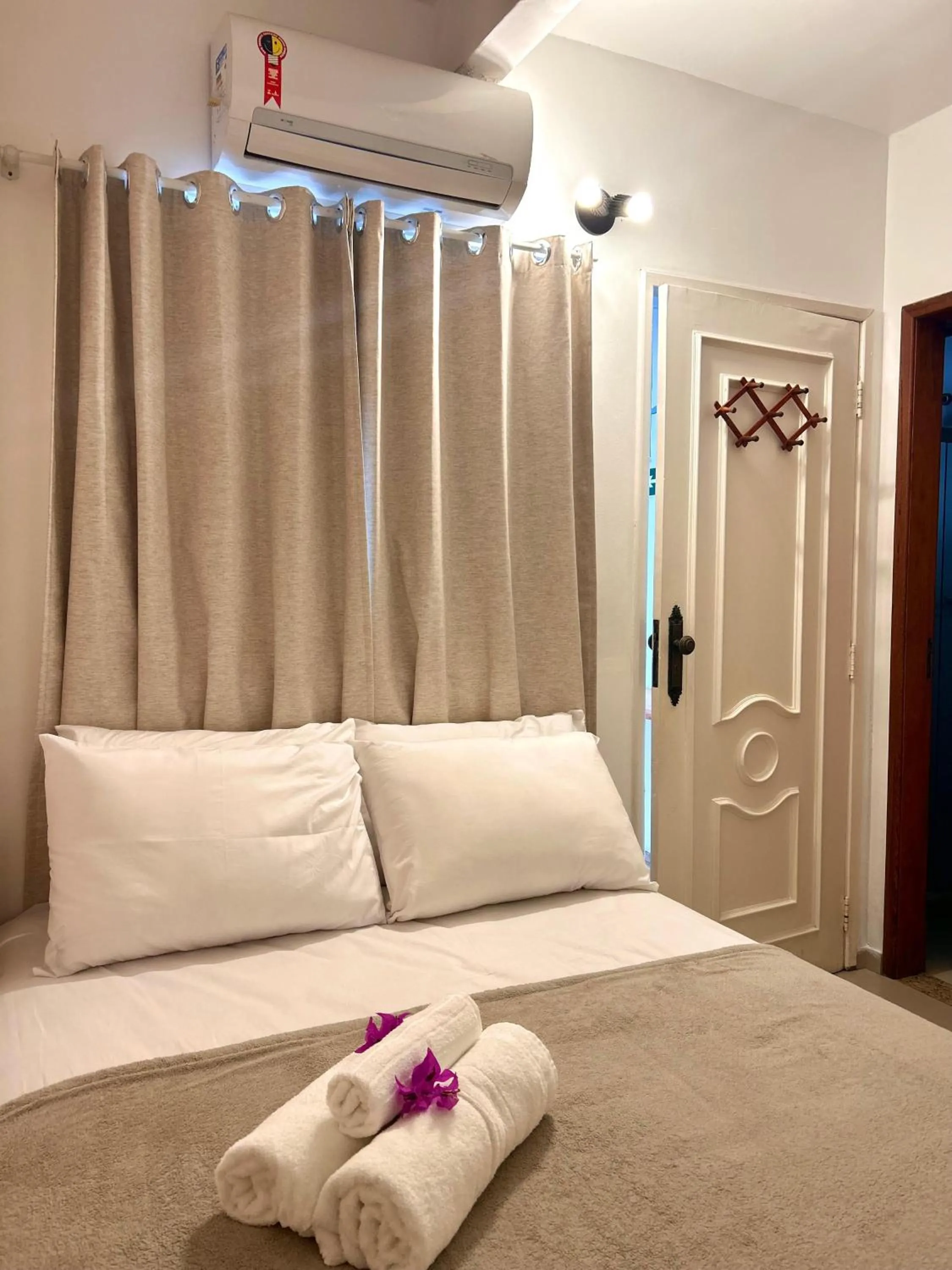 Bed in Bougainville Suítes