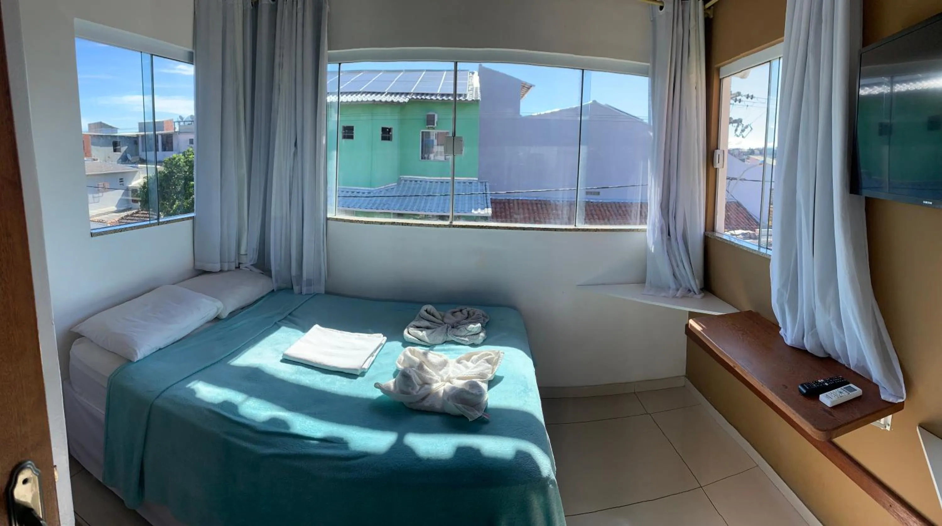 Bed in Bougainville Suítes