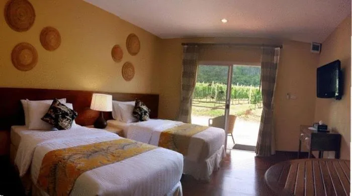 Bed in GRANMONTE Wine Cottage