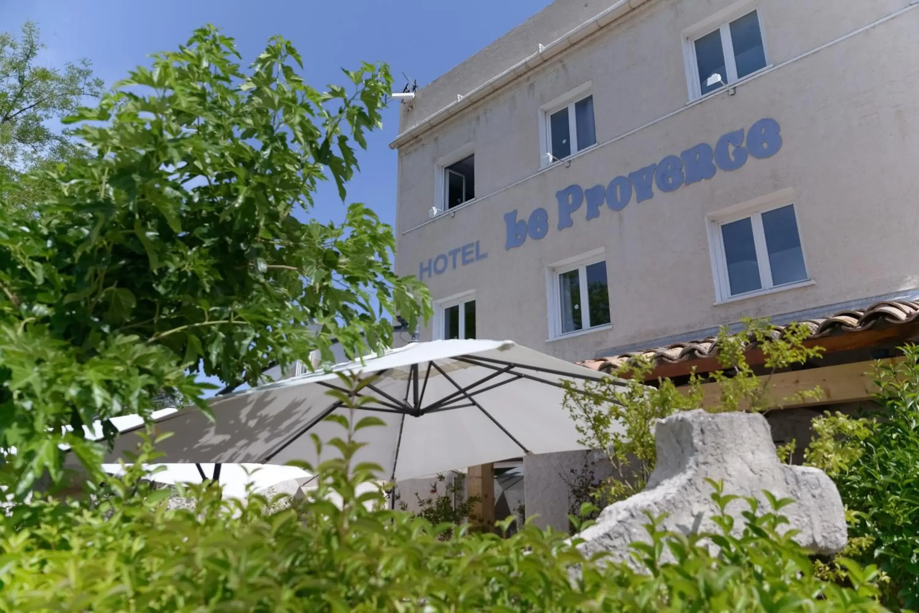 Property building in Contact Hôtel Le Provence Property building in Contact Hôtel Le Provence