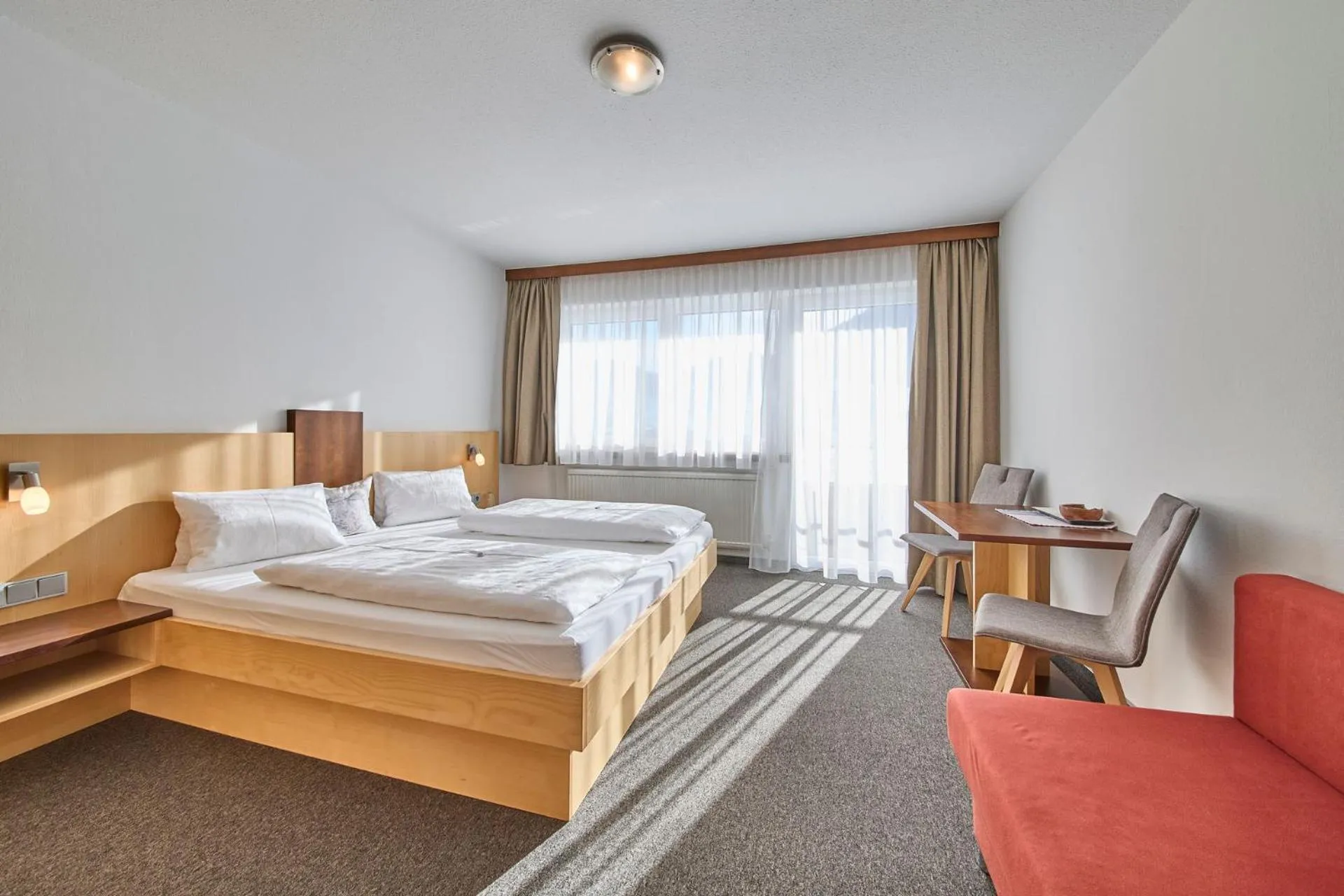 Bed in Hotel Garni Tirol