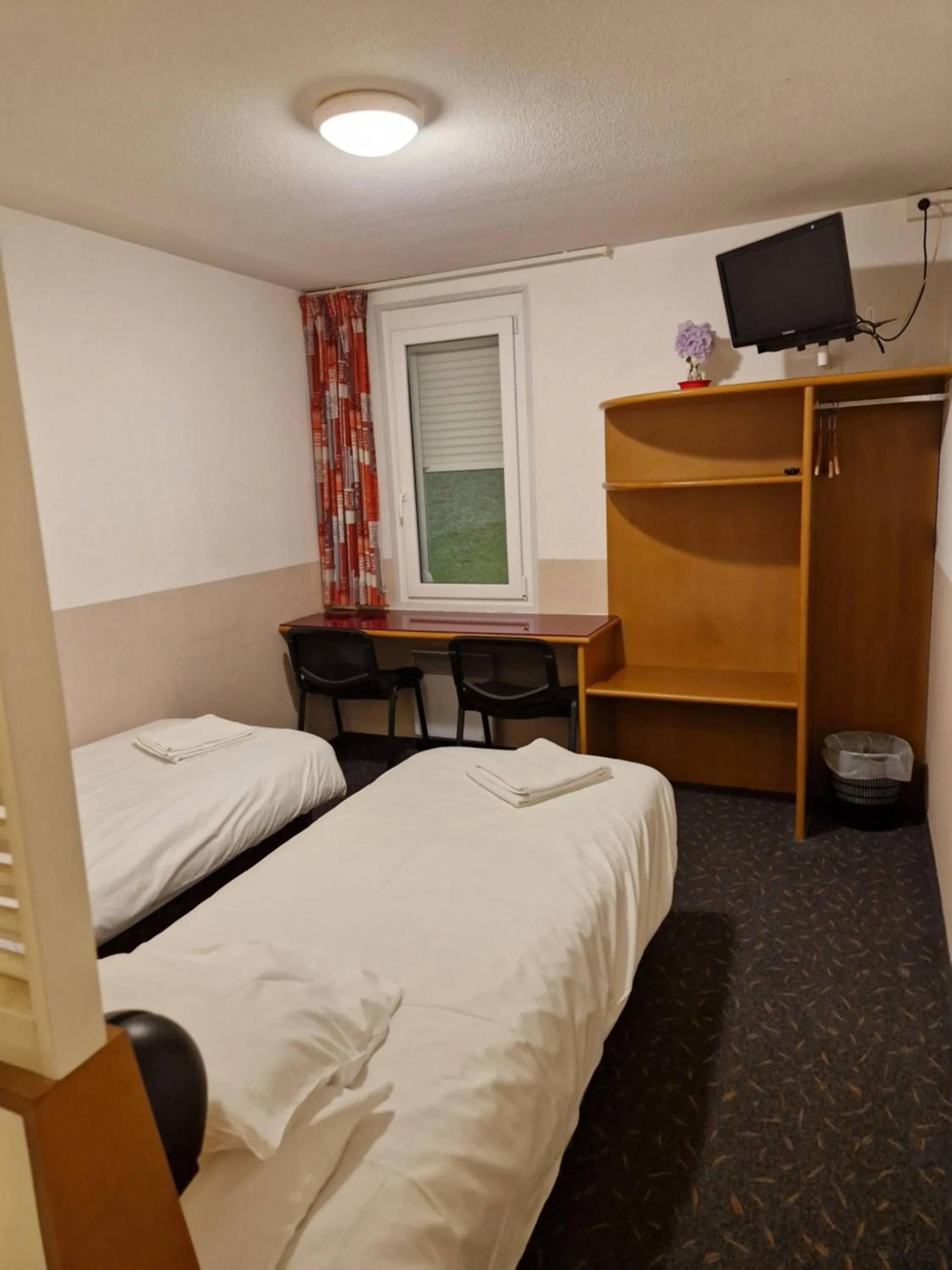 Bed in Quick Palace Vannes