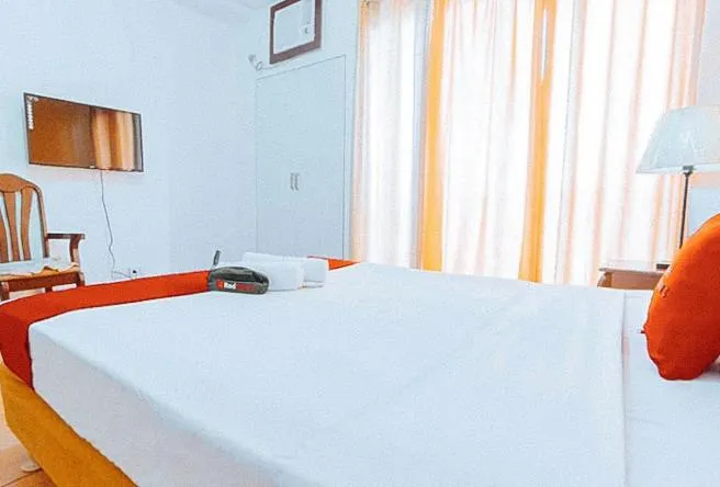 Bed in RedDoorz at Bel Air Soho Suites Makati City