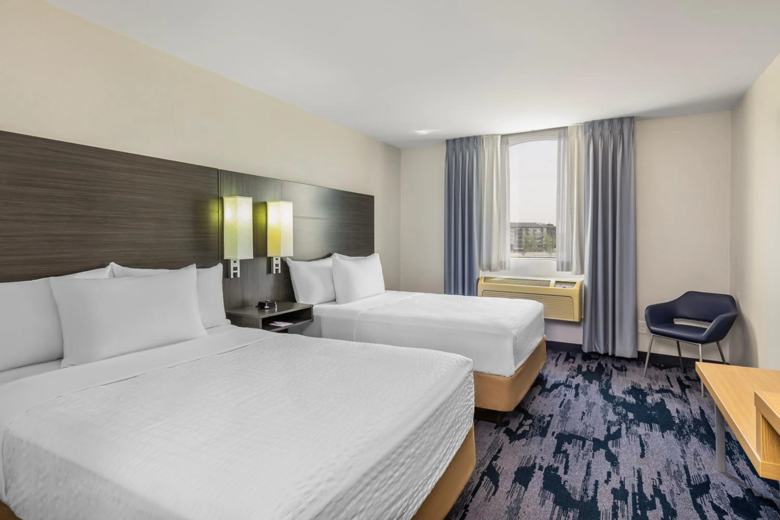 Bed in Quality Inn & Suites