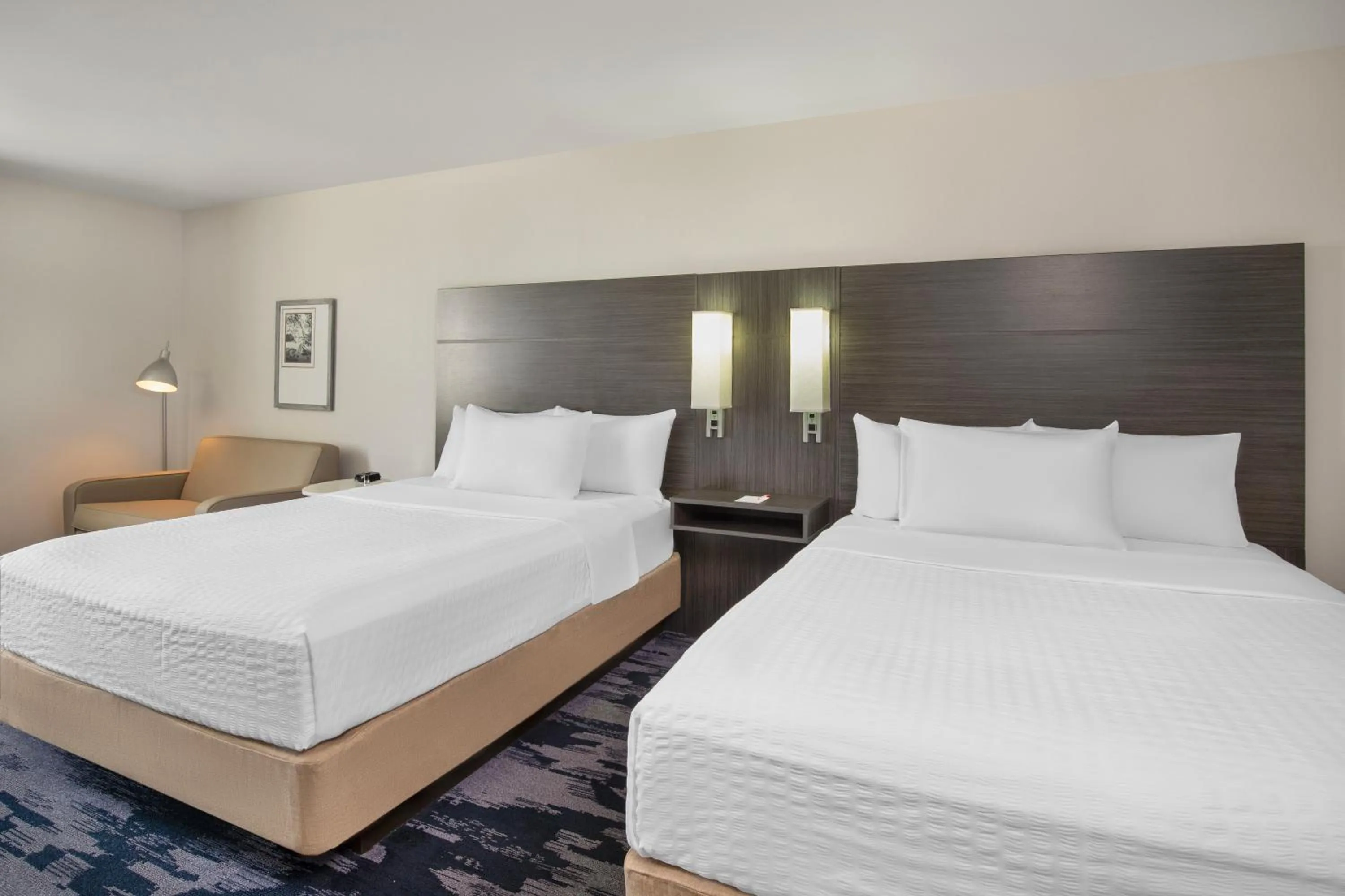 Bed in Quality Inn & Suites