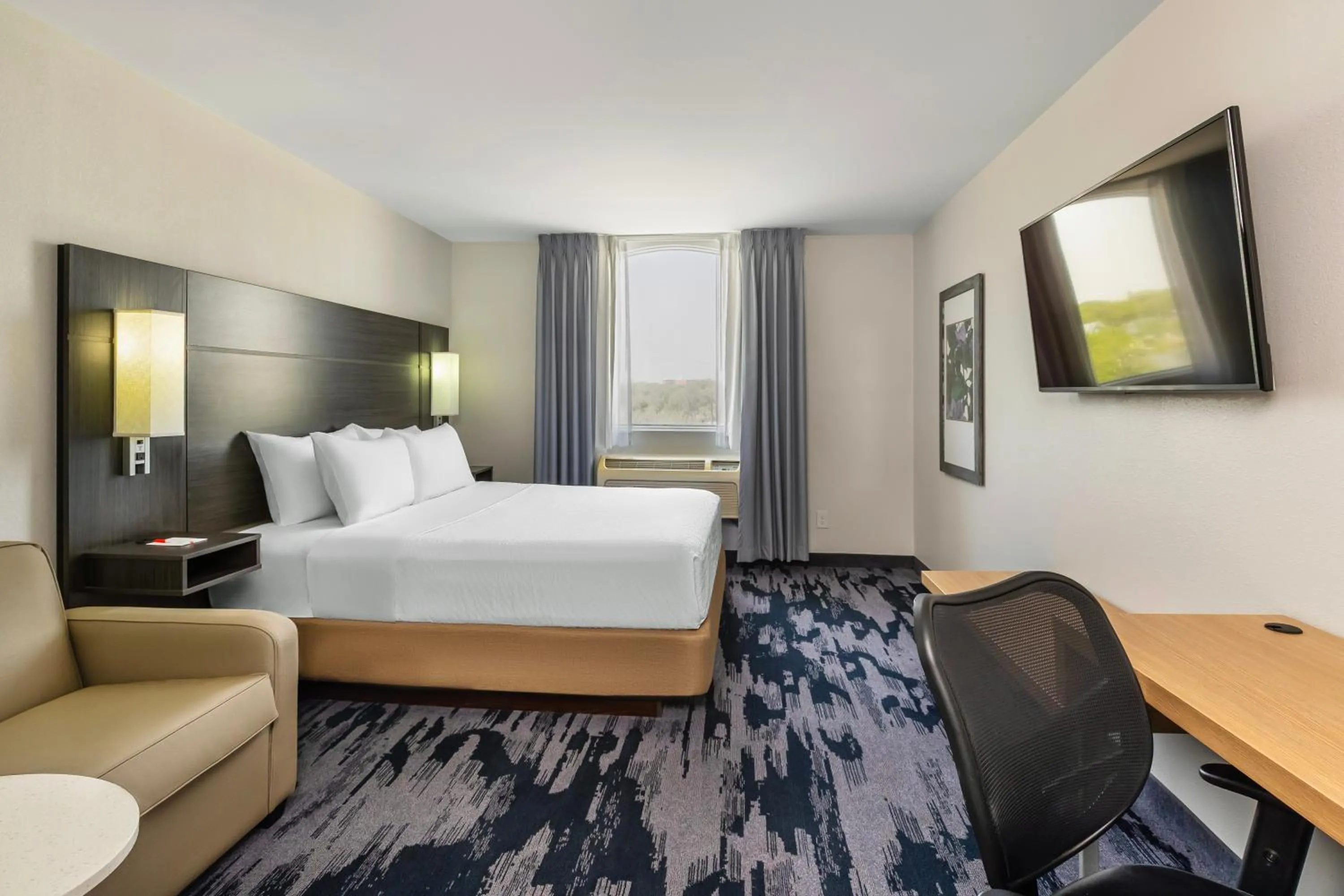 Bed in Quality Inn & Suites