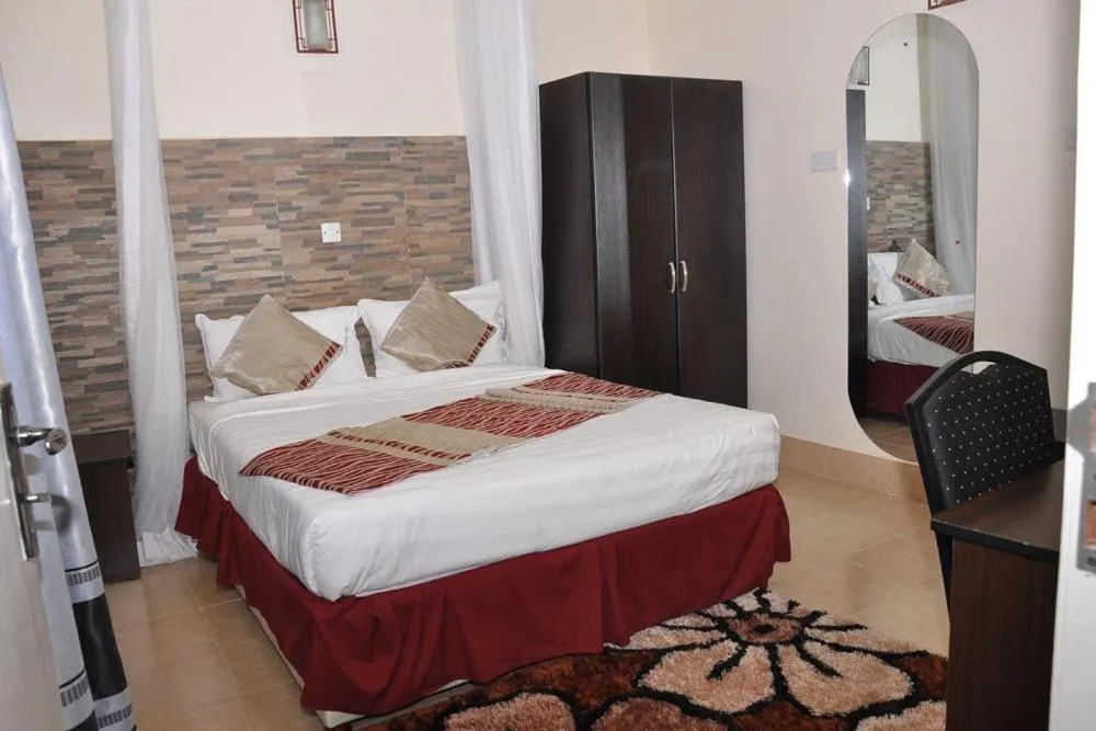 Photo of the whole room, Bed in Latitude 1 Suites