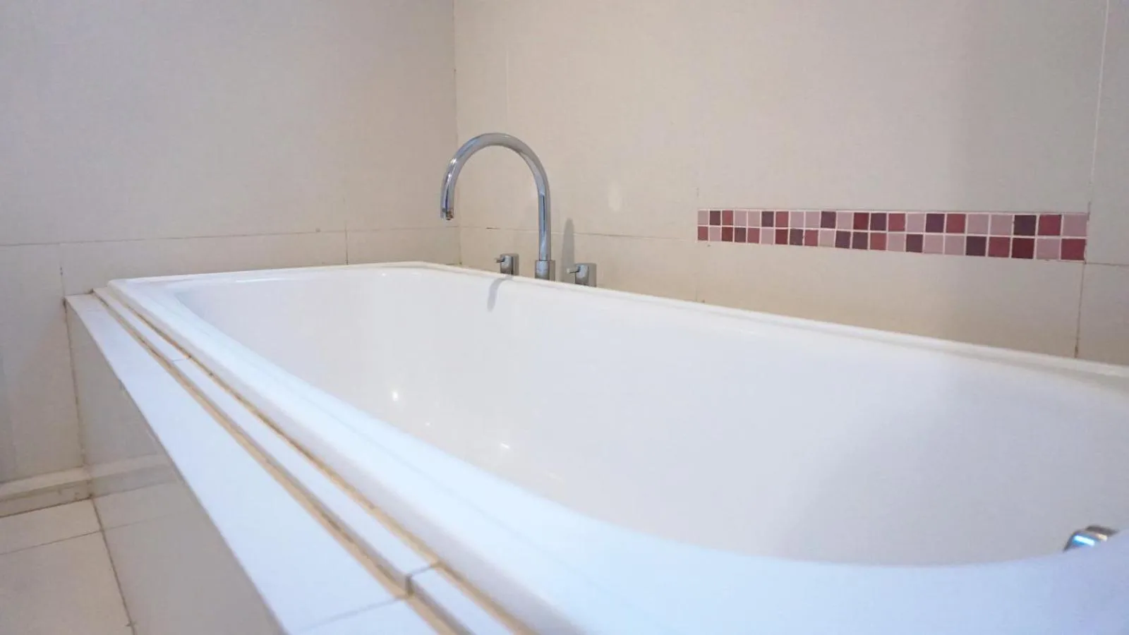 Bath in Conjioo Hotel Kuta Managed By MHM