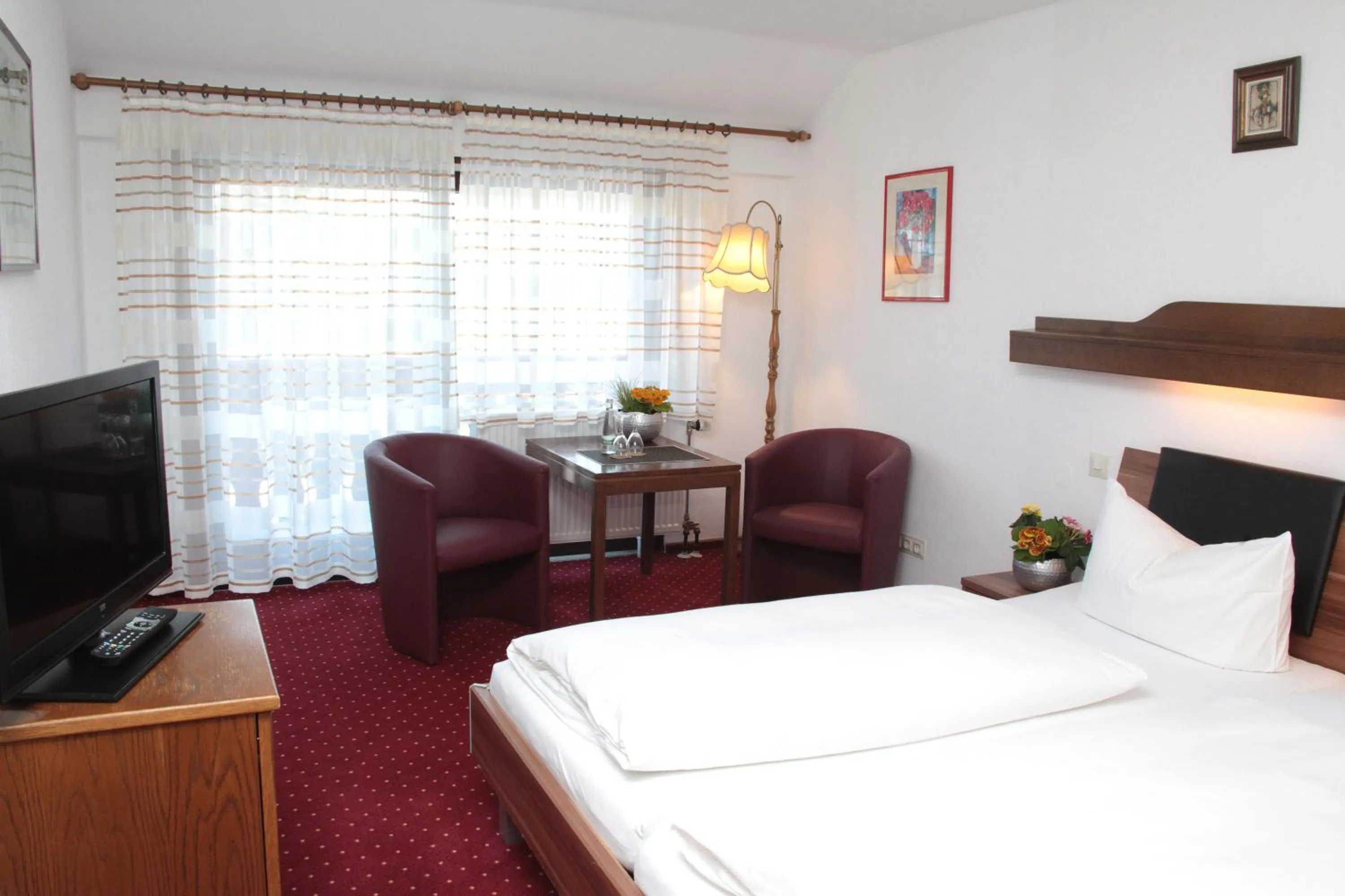 Photo of the whole room, Bed in Hotel an der Sonne & Restaurant Zum Schneiger