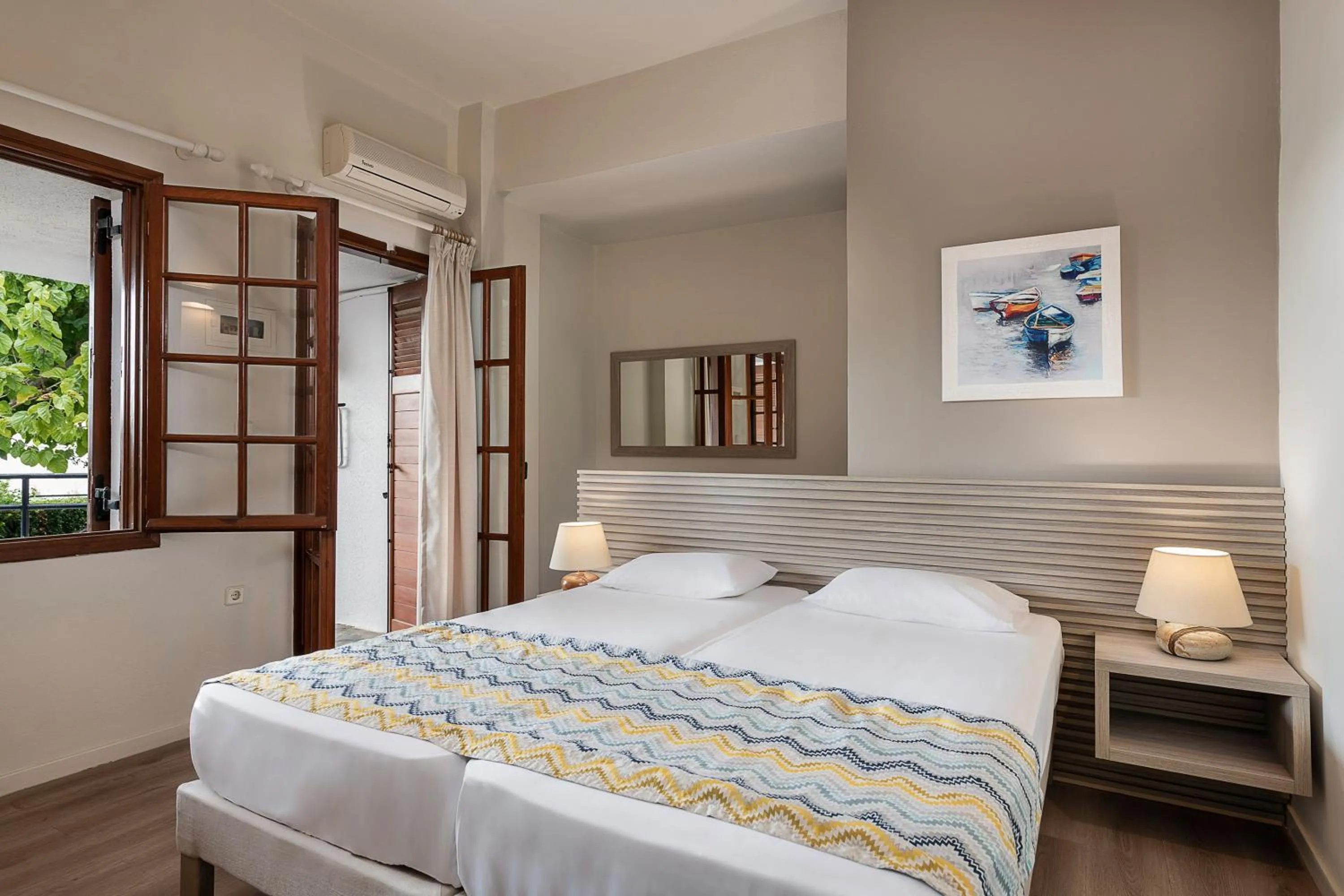Bed in Alianthos Suites