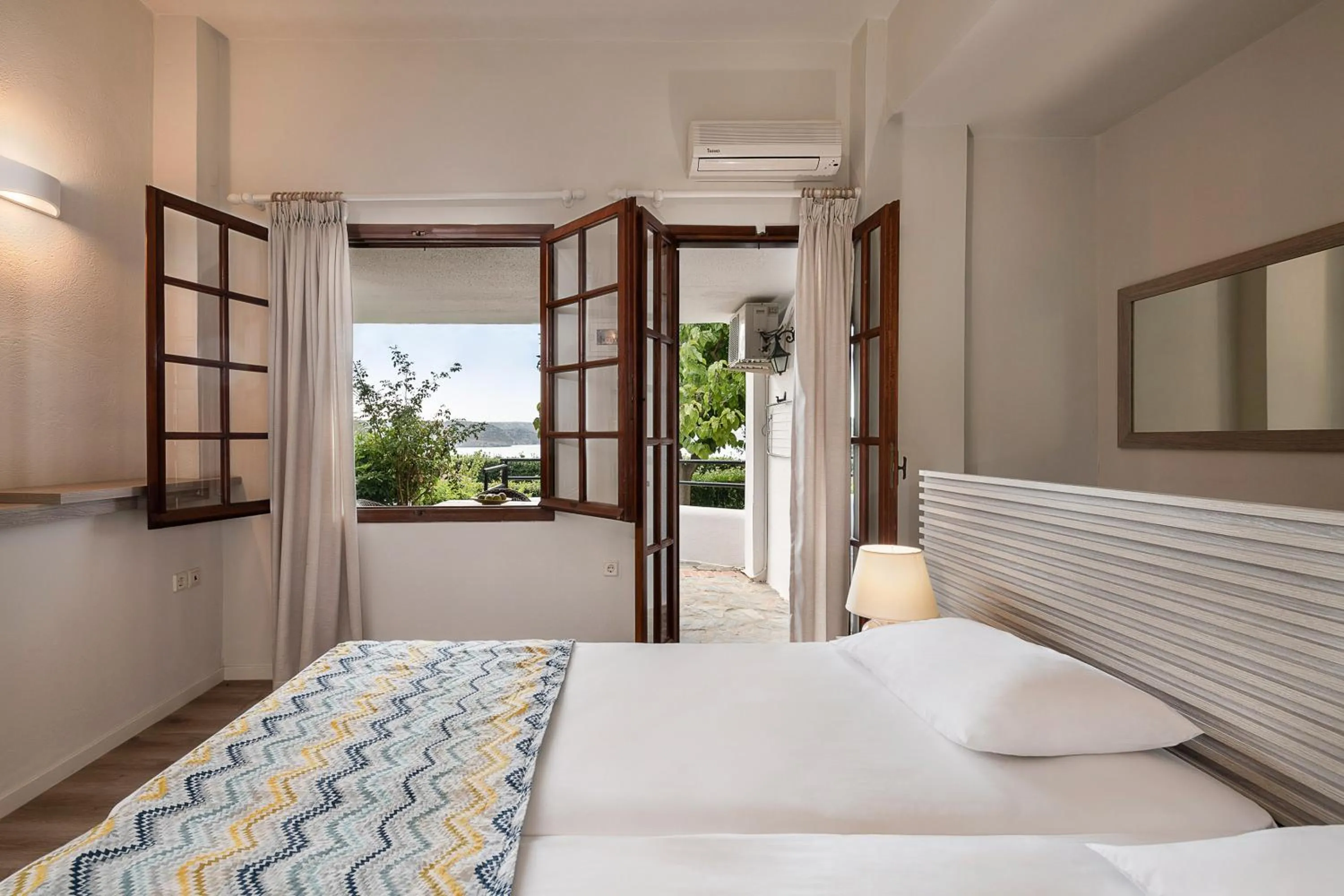 Bed in Alianthos Suites