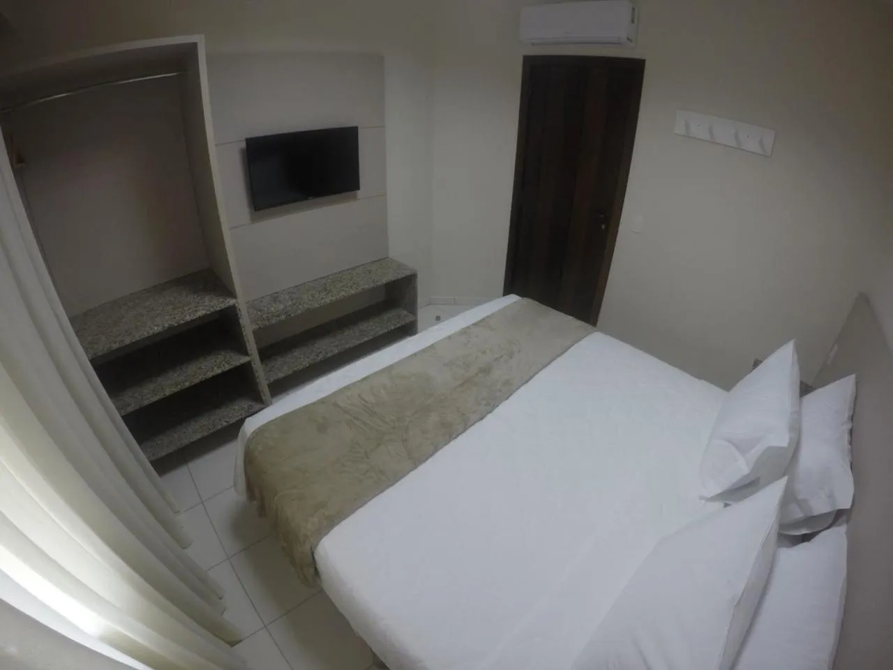 Bed in Pousada Doluar