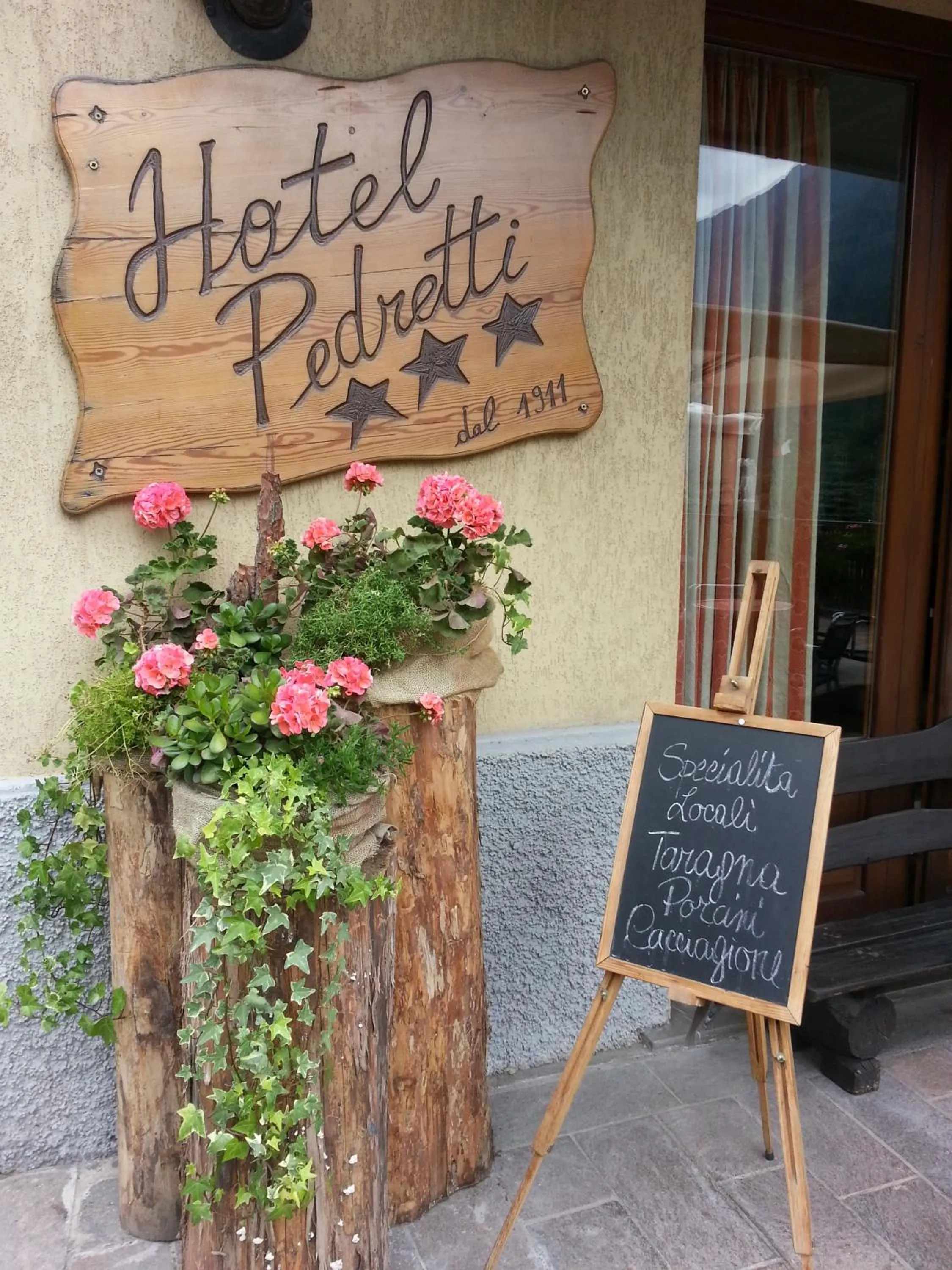 Property logo or sign in Hotel Pedretti