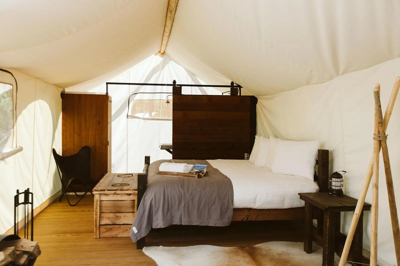 Photo of the whole room, Bed in Under Canvas Mount Rushmore