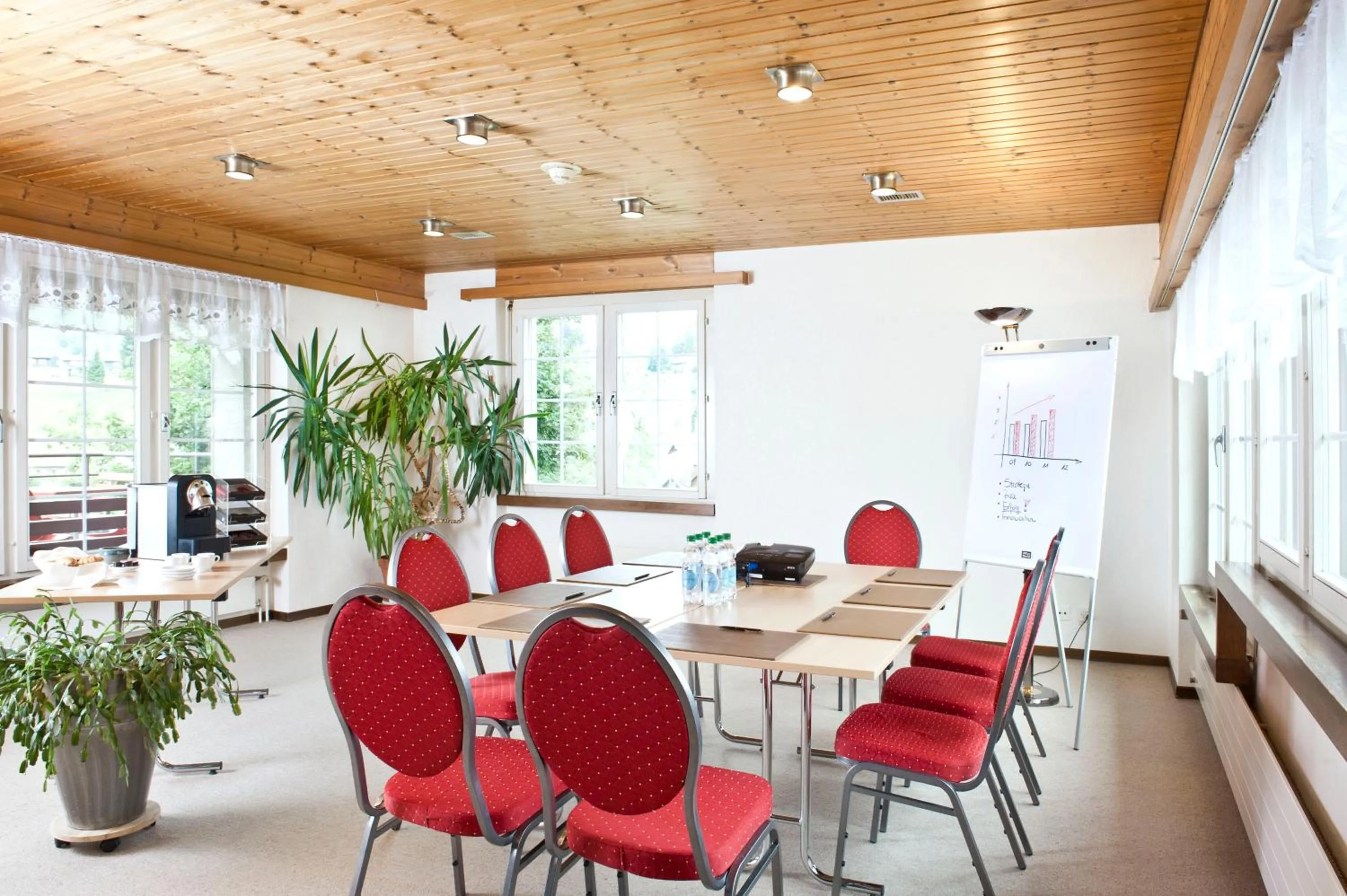 Communal lounge/ TV room in Hotel am Schönenbühl
