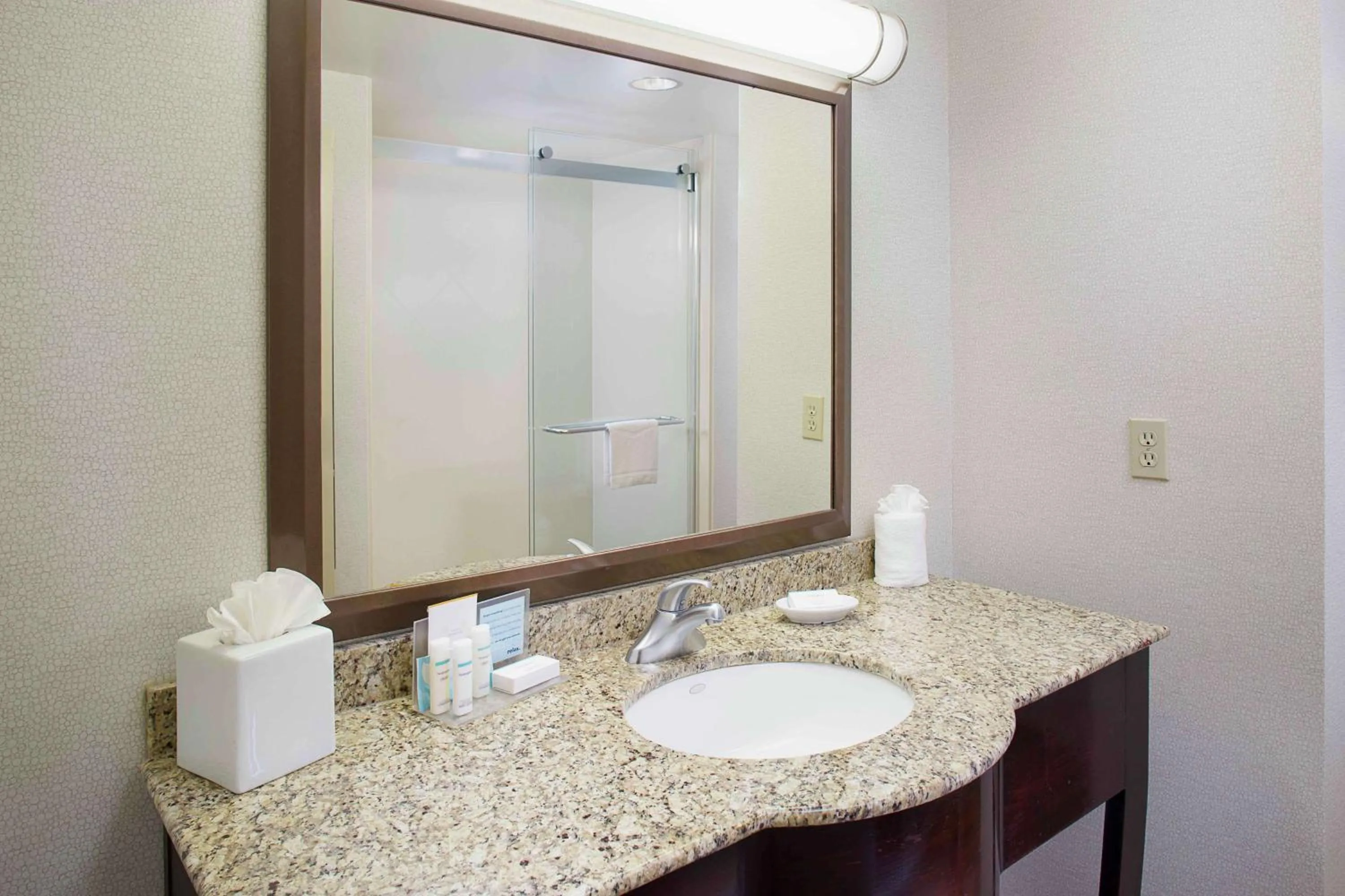 Bathroom in Hampton Inn by Hilton Garden City Long Island