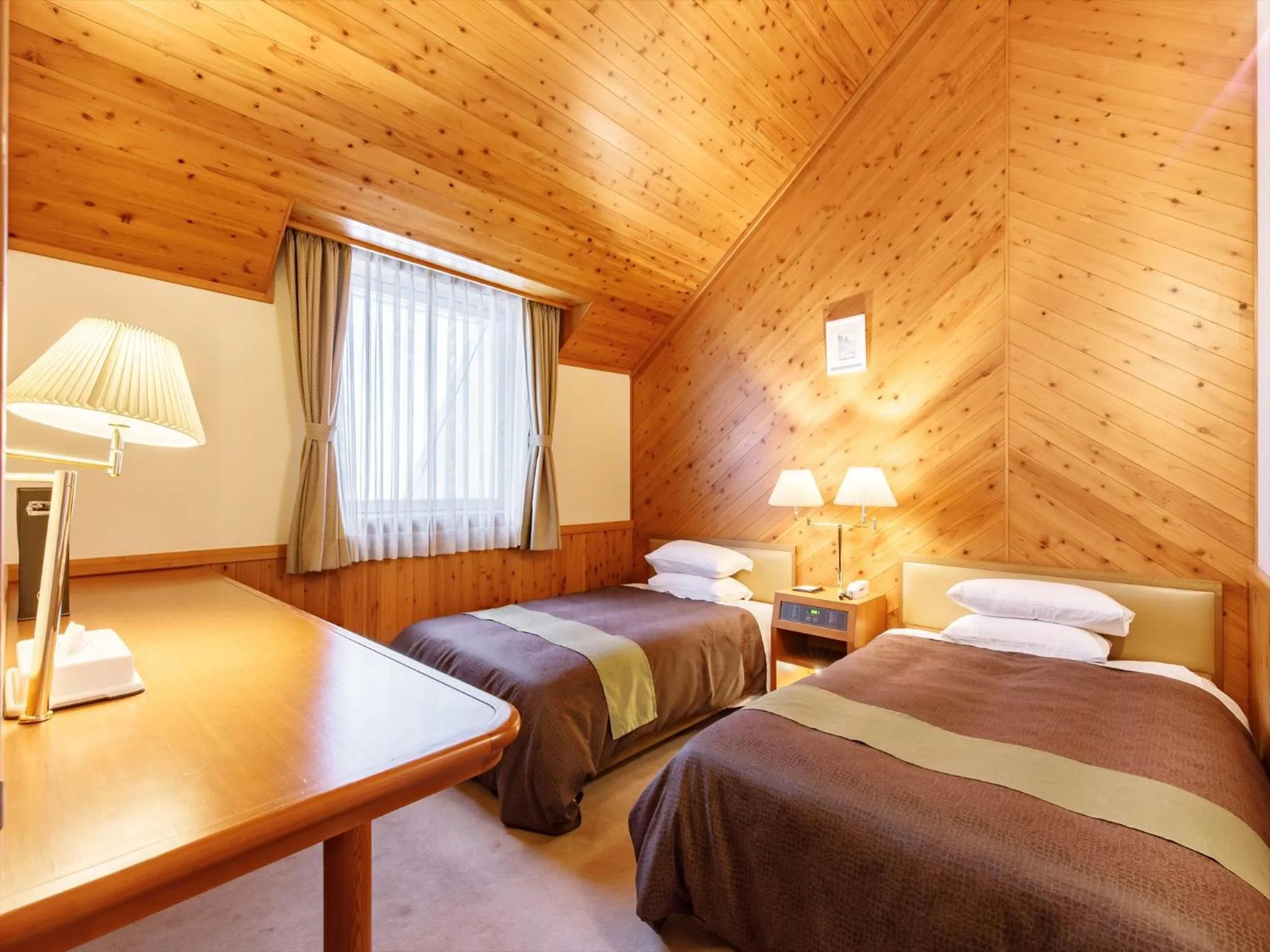 Bed in Kibi Kogen Resort Hotel