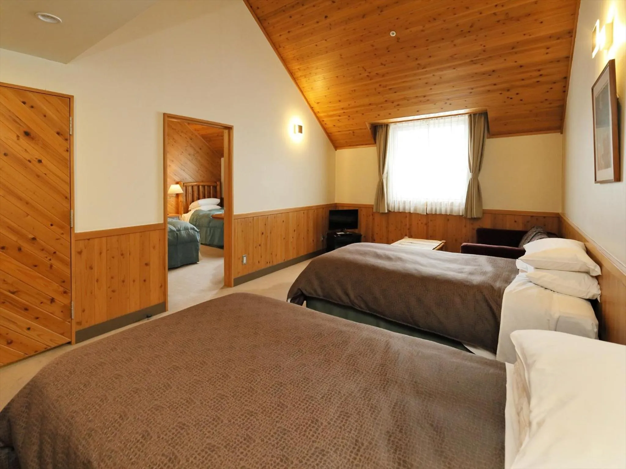 Bed in Kibi Kogen Resort Hotel