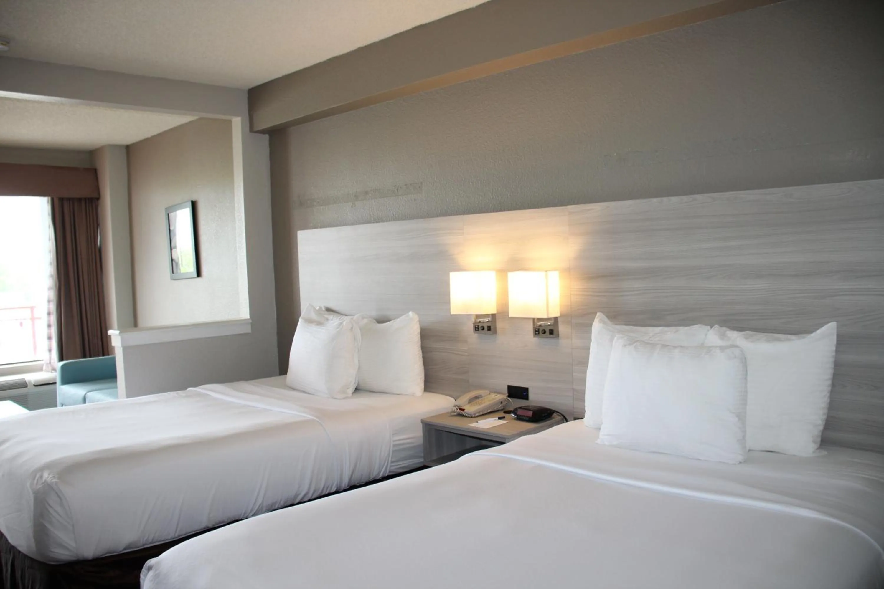 Bed in Boca Suites Deerfield Beach; SureStay Collection by BW