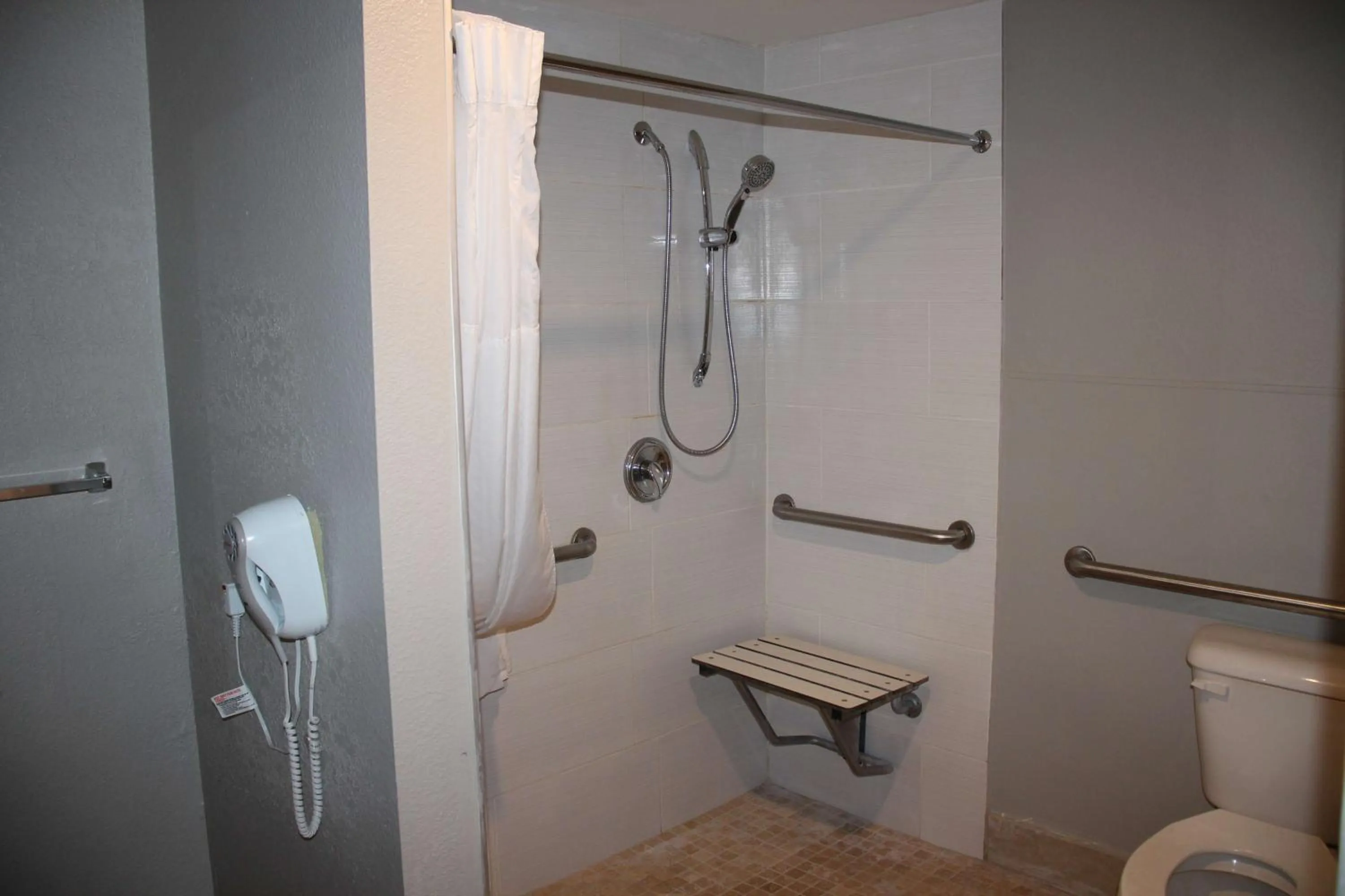 Bathroom in Boca Suites Deerfield Beach; SureStay Collection by BW