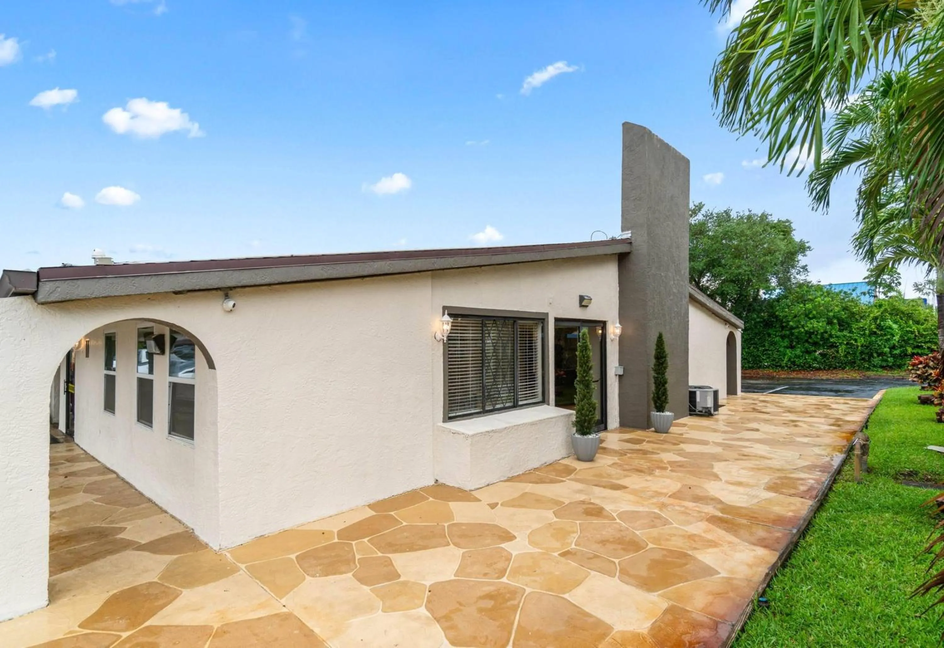 Property building in Super 8 by Wyndham Lantana West Palm Beach