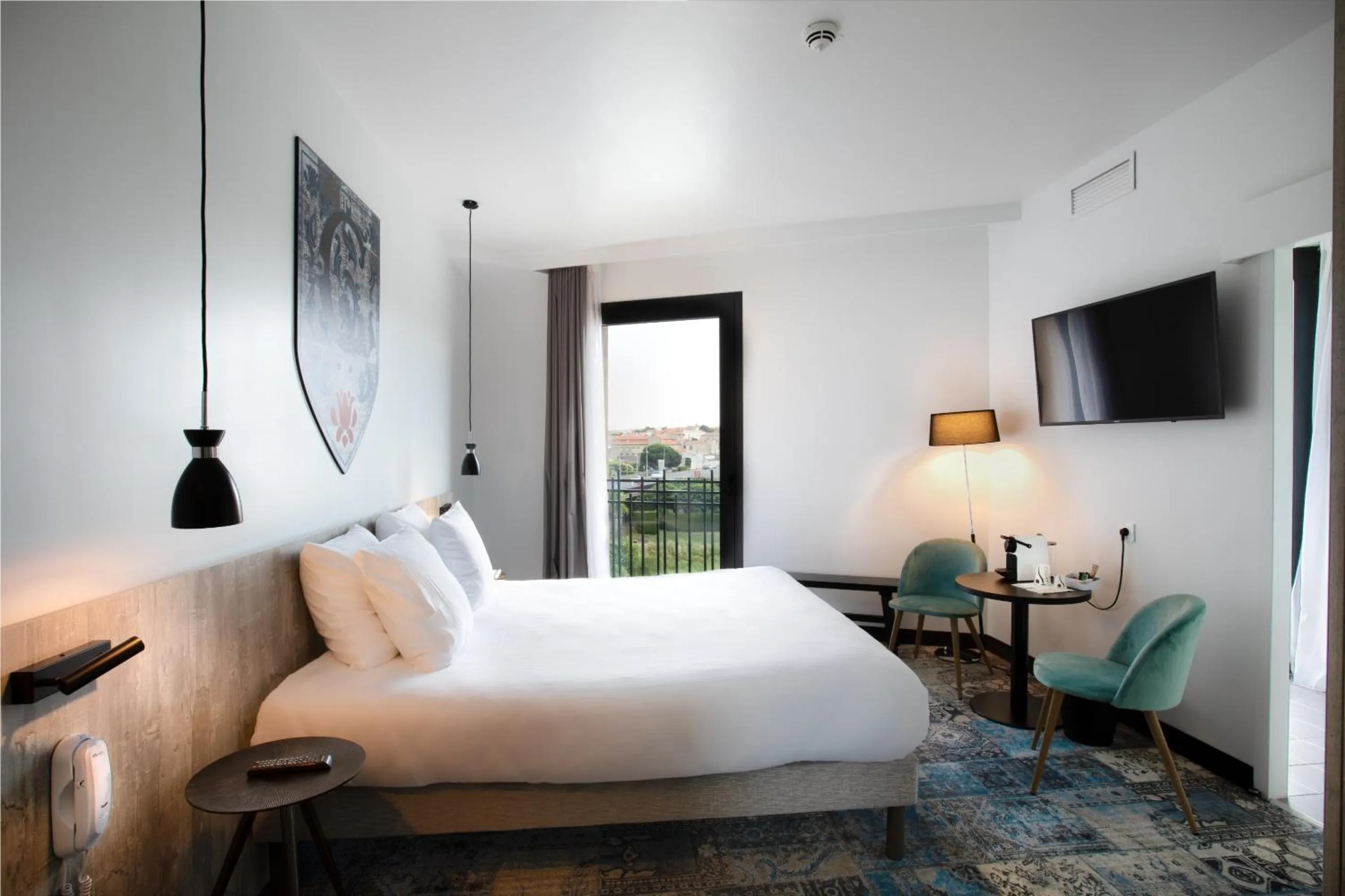 Bed in SOWELL HOTELS Les Chevaliers