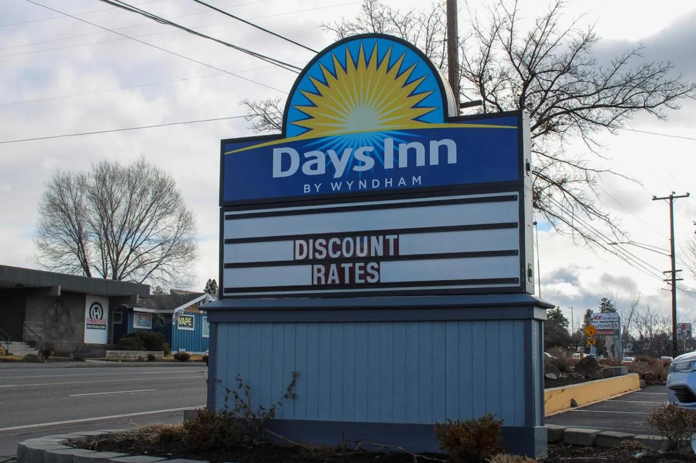 Property logo or sign in Days Inn by Wyndham Bend