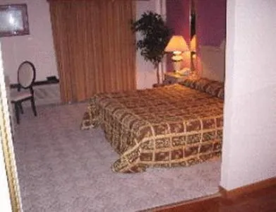 Bed in Chateau Royale Inn