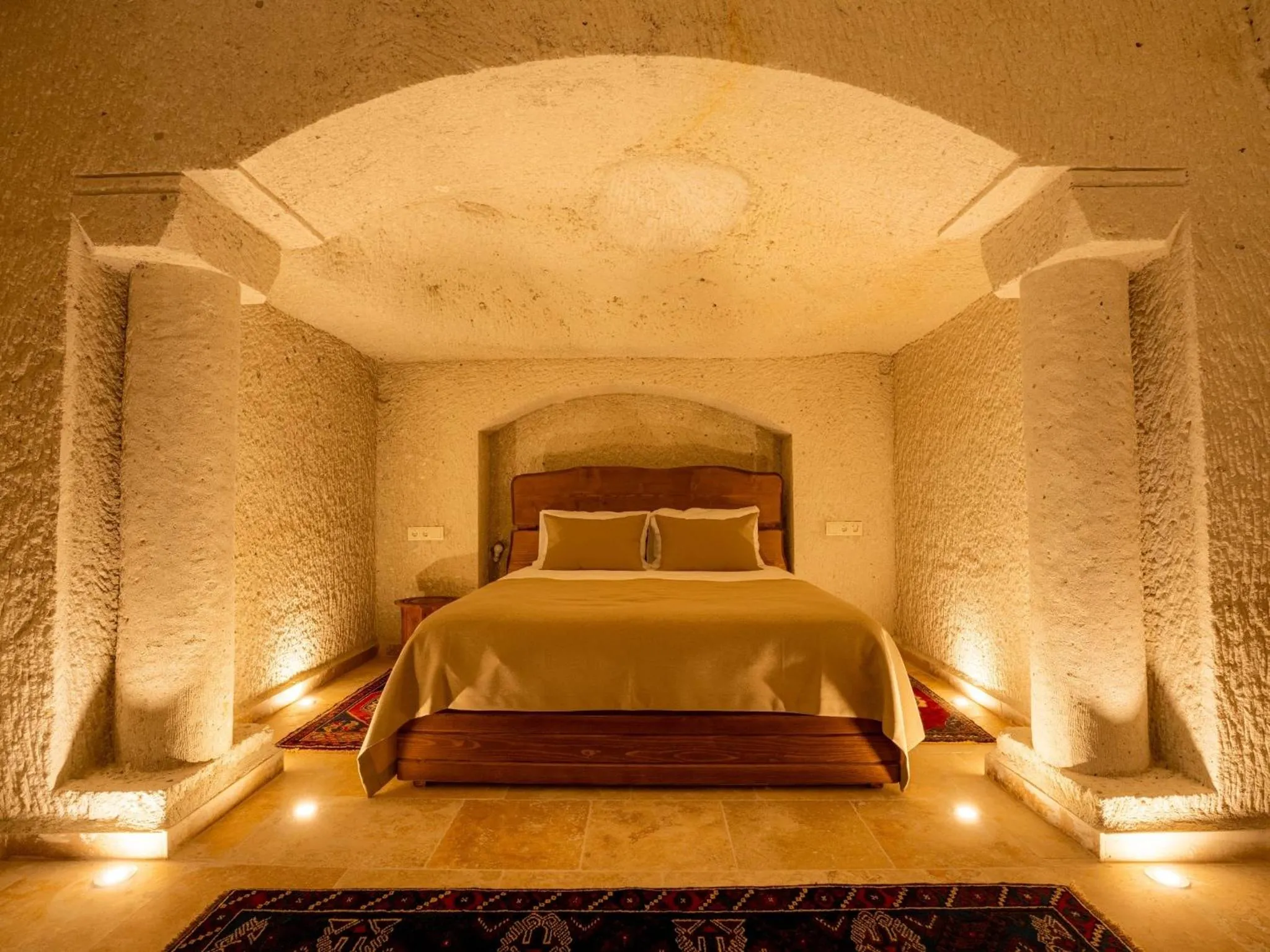 Bed in Tulip Cave Suites