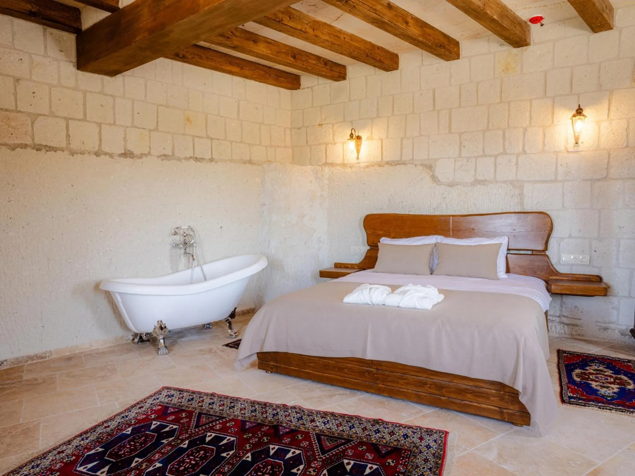 Bed in Tulip Cave Suites