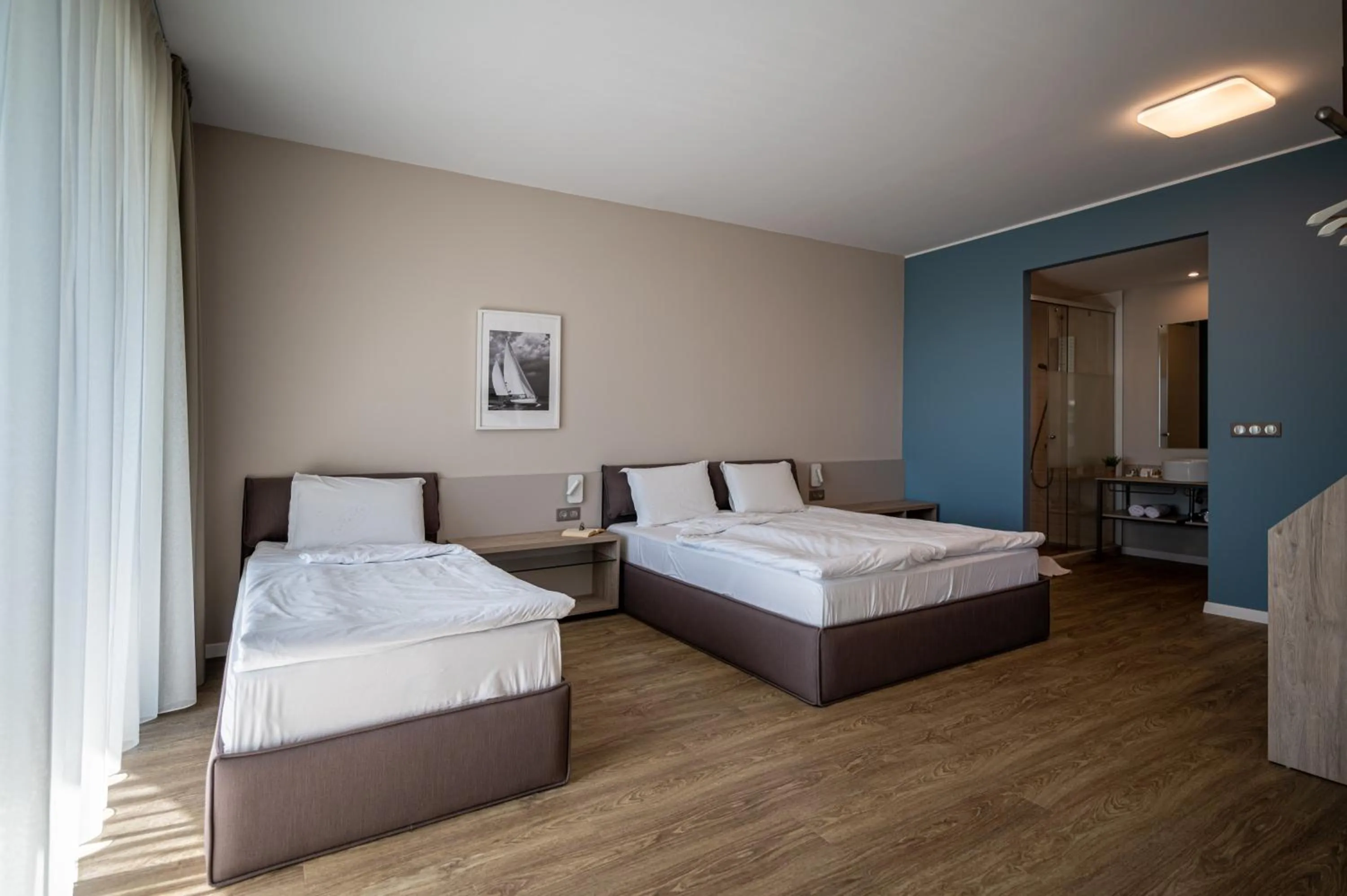 Bed in Romance Hotel and Family Suites