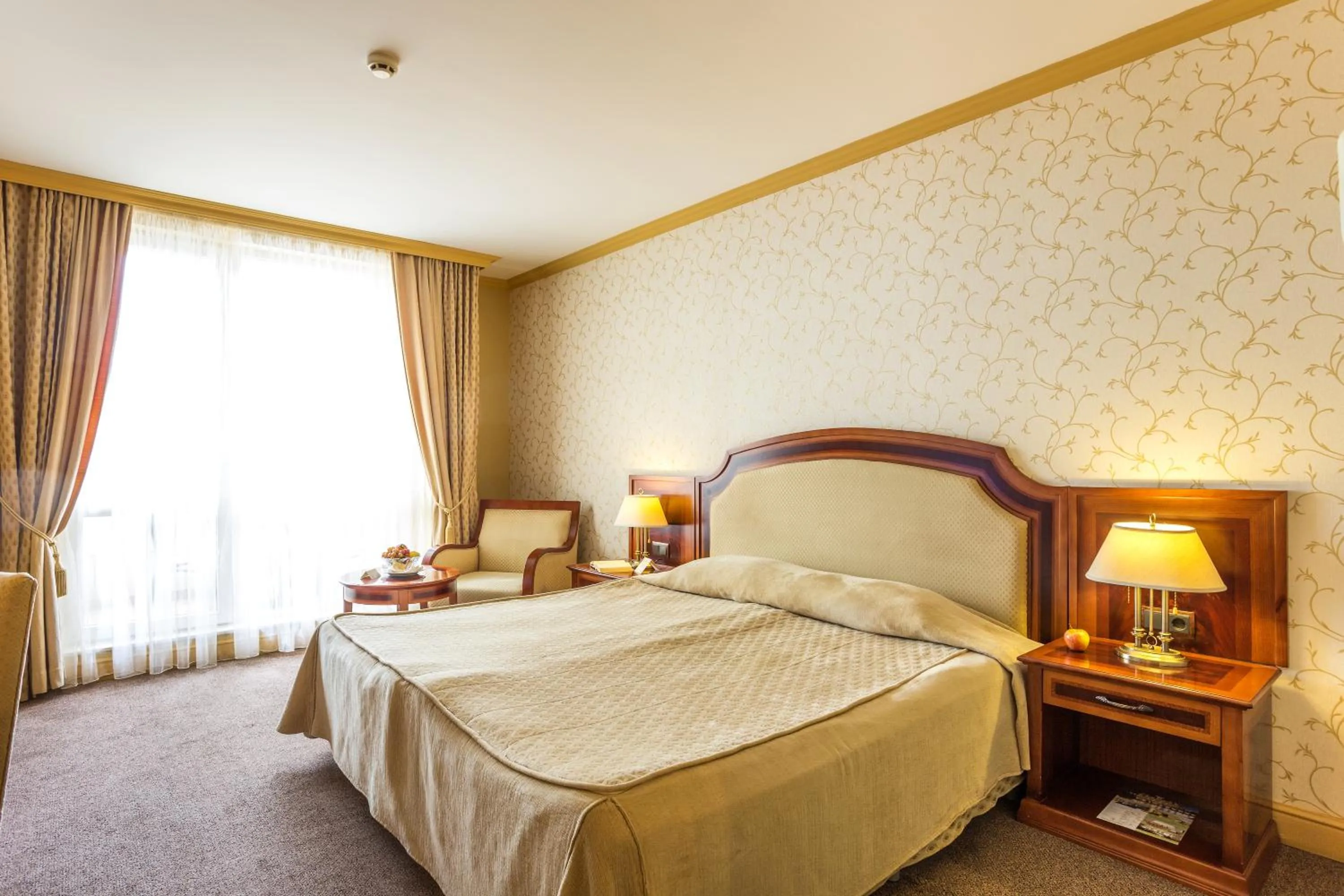 Bed in Romance Hotel and Family Suites