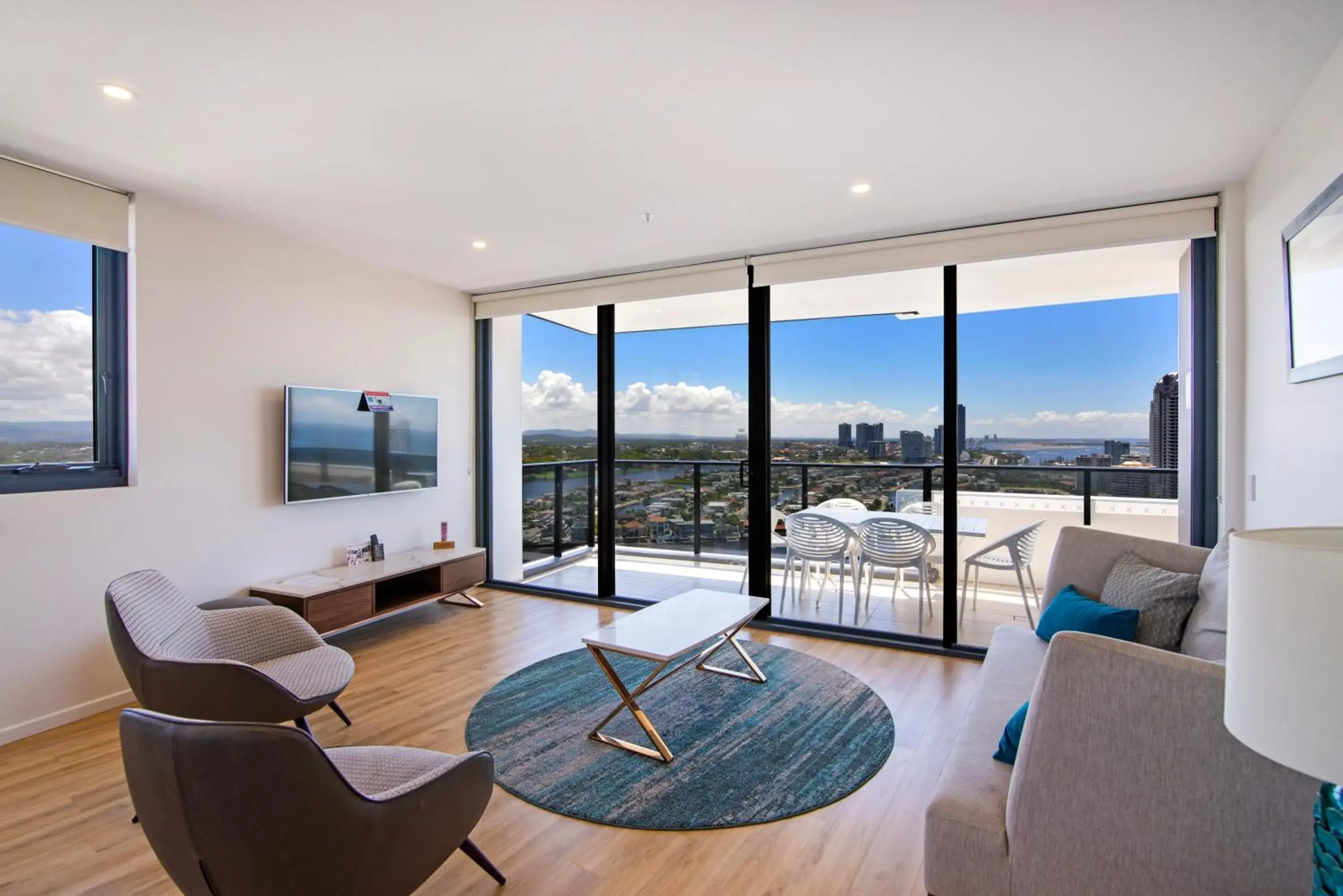 Living room in Ruby Gold Coast by CLLIX Living room in Ruby Gold Coast by CLLIX
