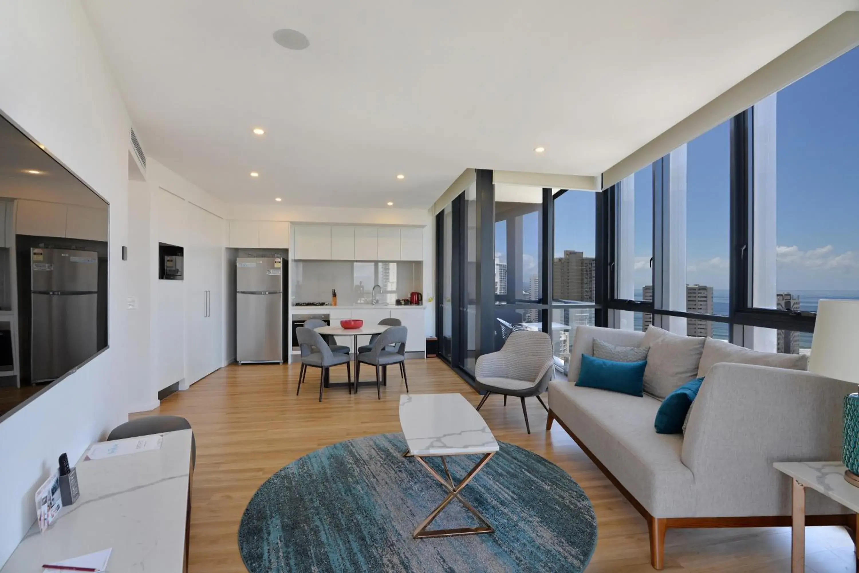 Living room in Ruby Gold Coast by CLLIX Living room in Ruby Gold Coast by CLLIX