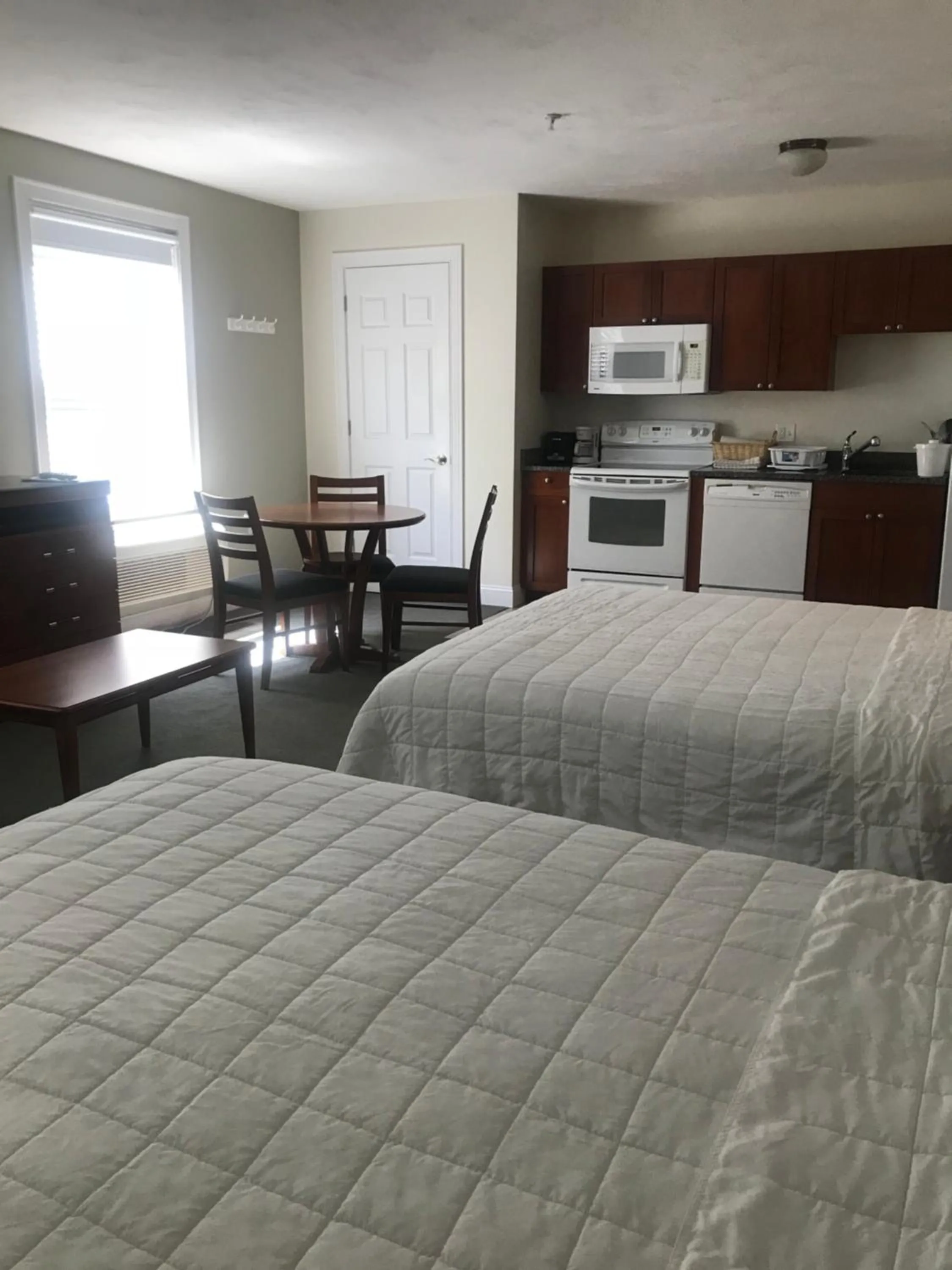 Bed in Crescent Suites Hotel