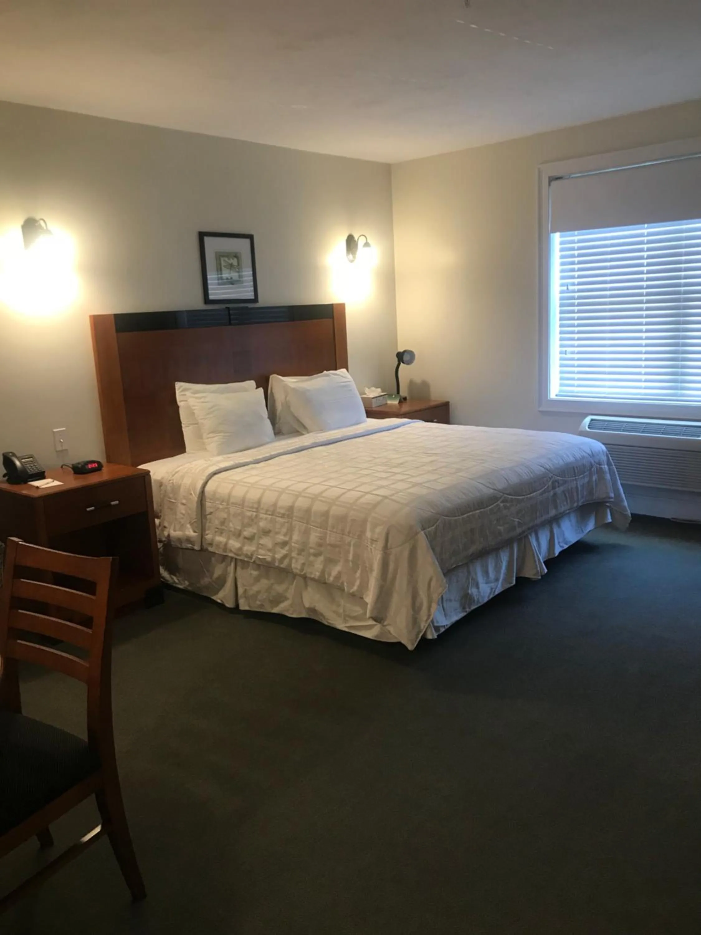 Bed in Crescent Suites Hotel