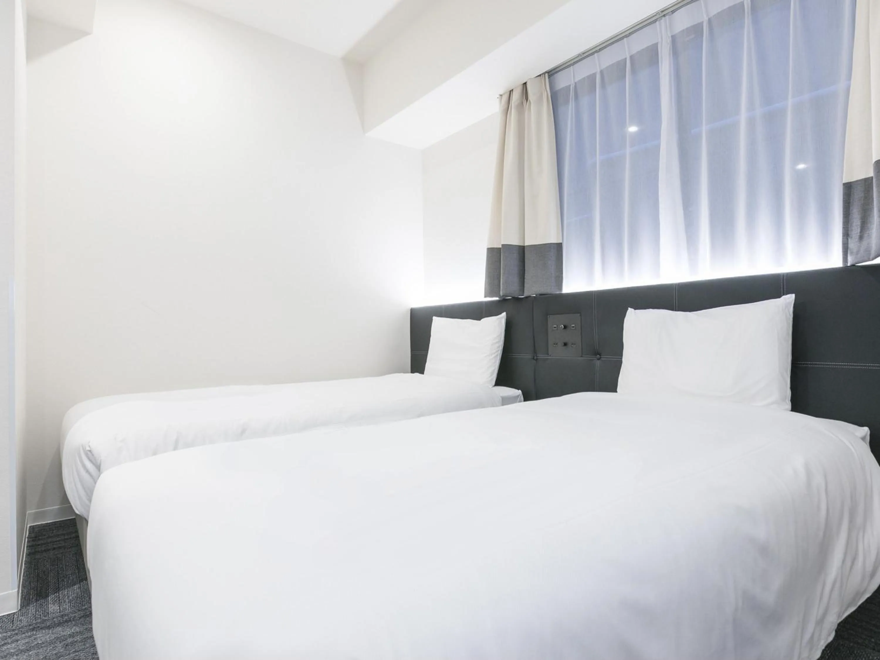 Bed in Henn na Hotel Osaka Namba