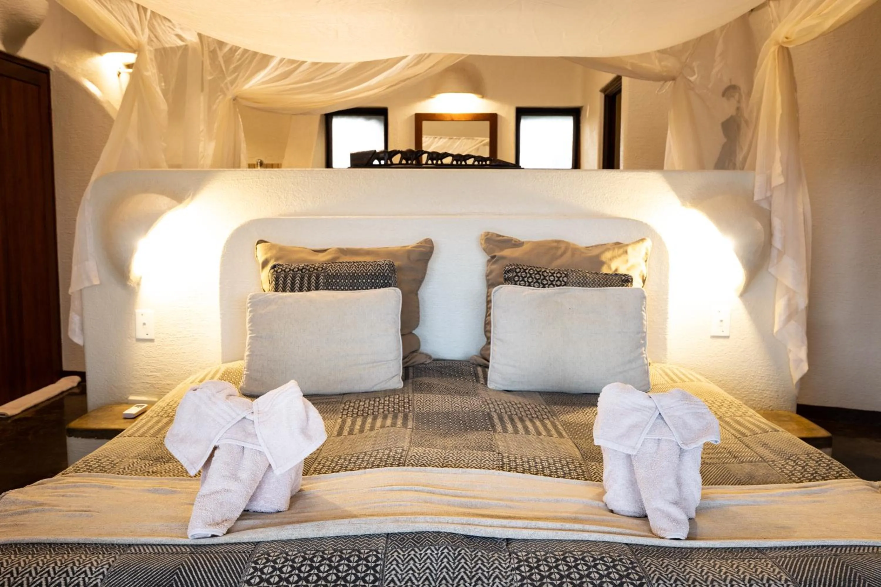 Bed in Nyati Safari Lodge