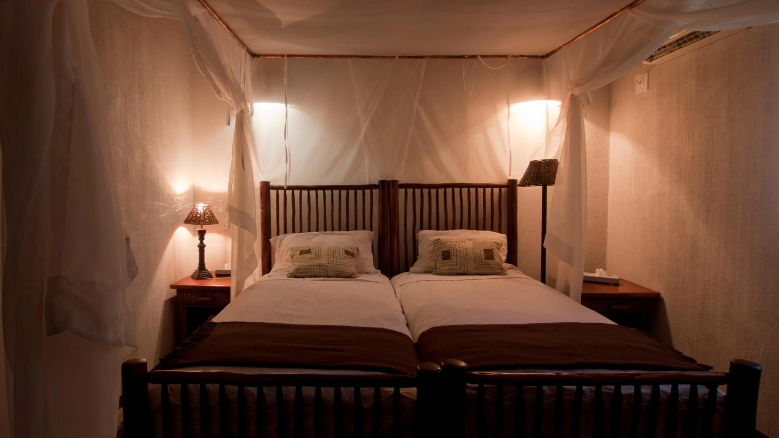 Bed in Nyati Safari Lodge