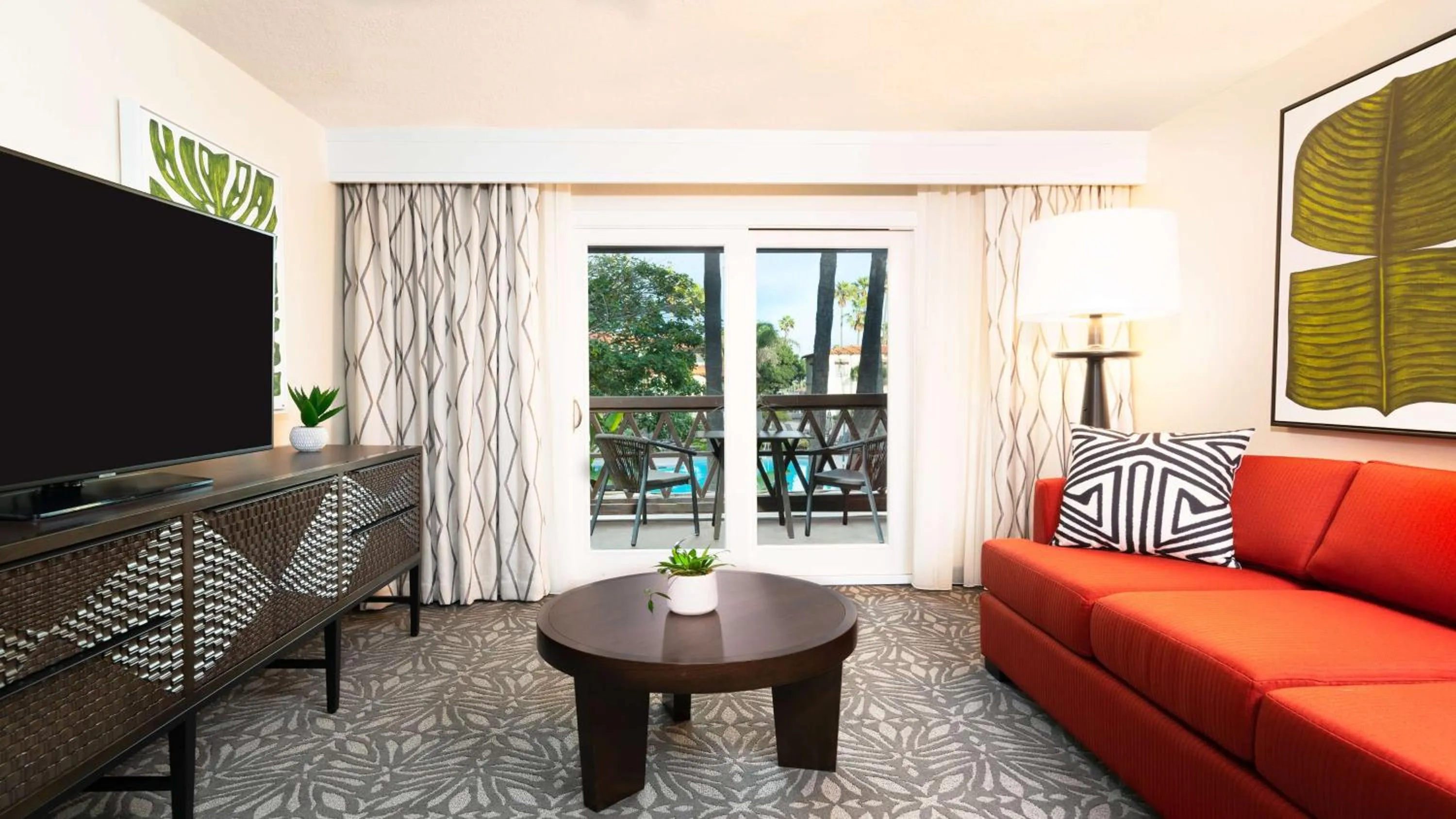 Living room in Zachari Dunes on Mandalay Beach, Curio Collection by Hilton