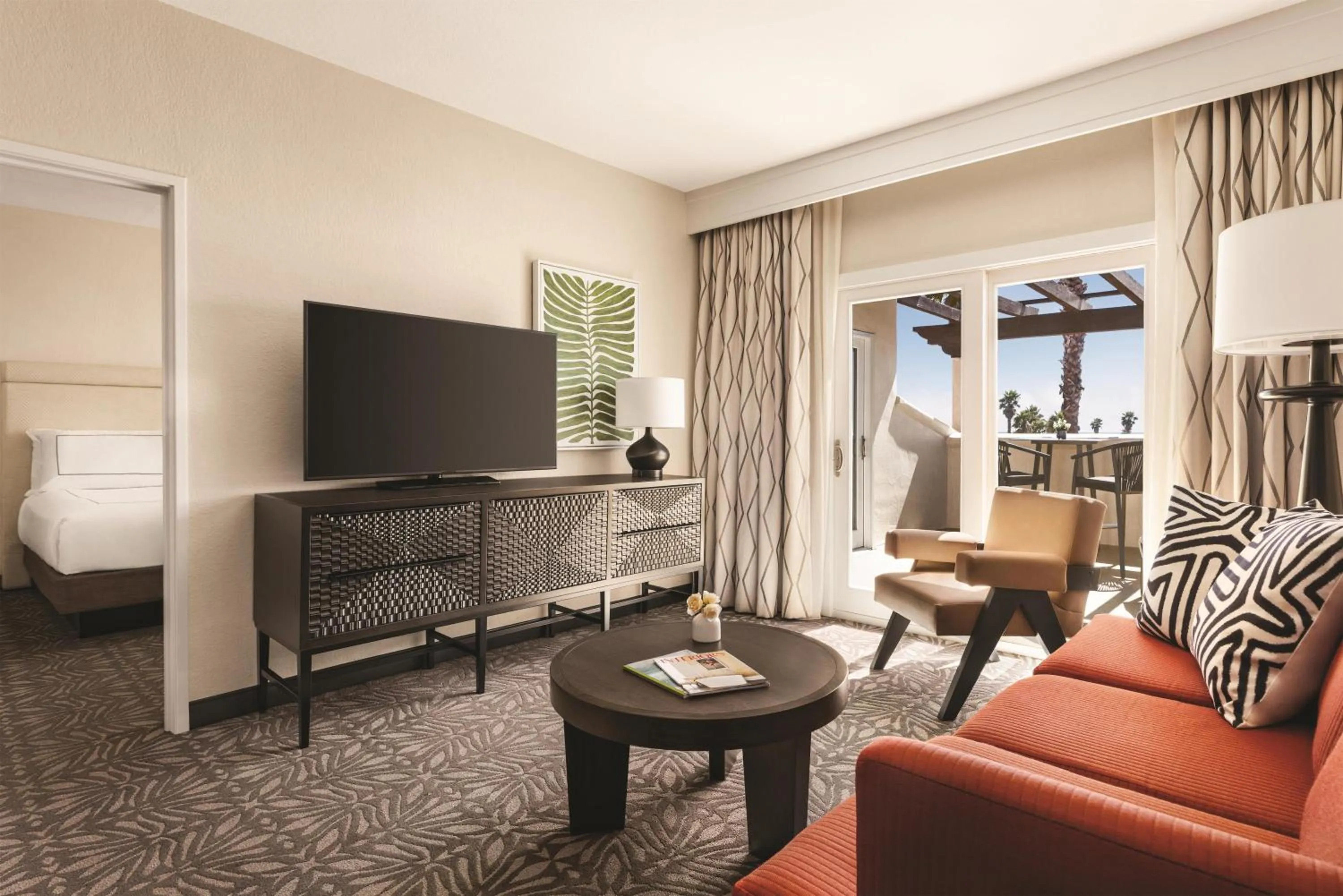 Living room in Zachari Dunes on Mandalay Beach, Curio Collection by Hilton