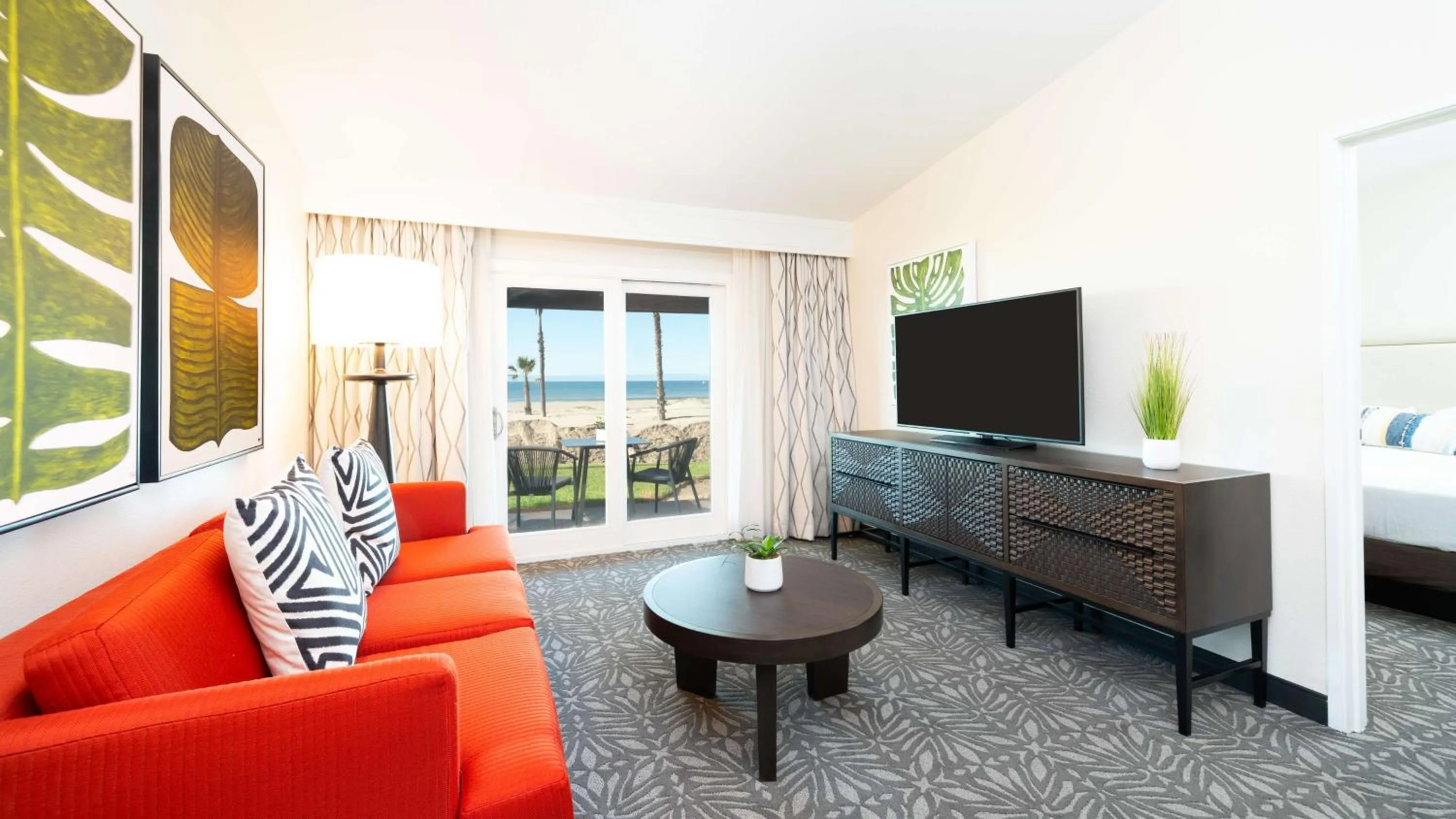 Living room in Zachari Dunes on Mandalay Beach, Curio Collection by Hilton