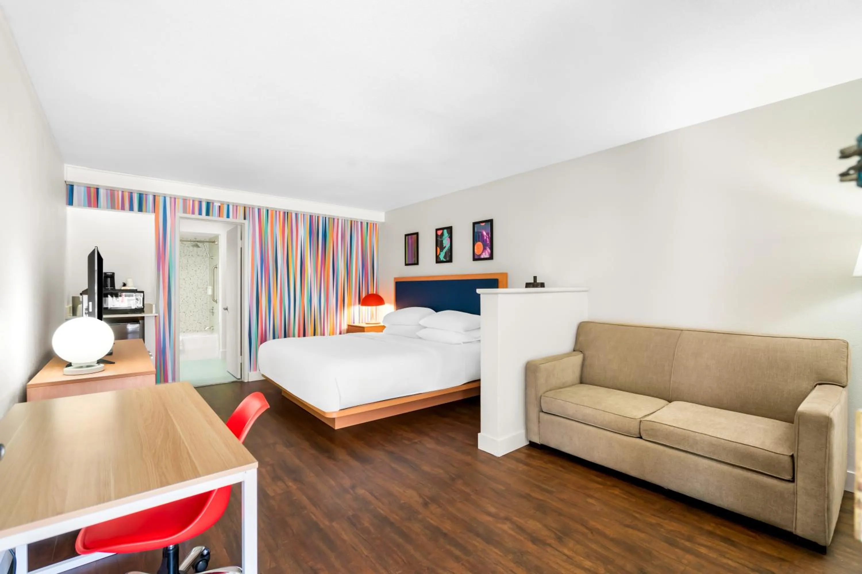 Living room, Bed in Signature Indio I-10 Coachella Valley by Sonesta