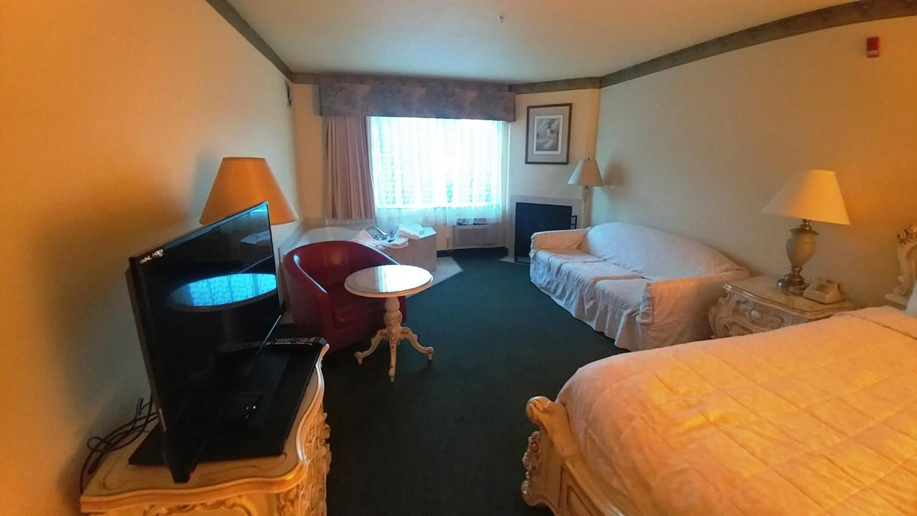 Bed in Palace Inn & Suites