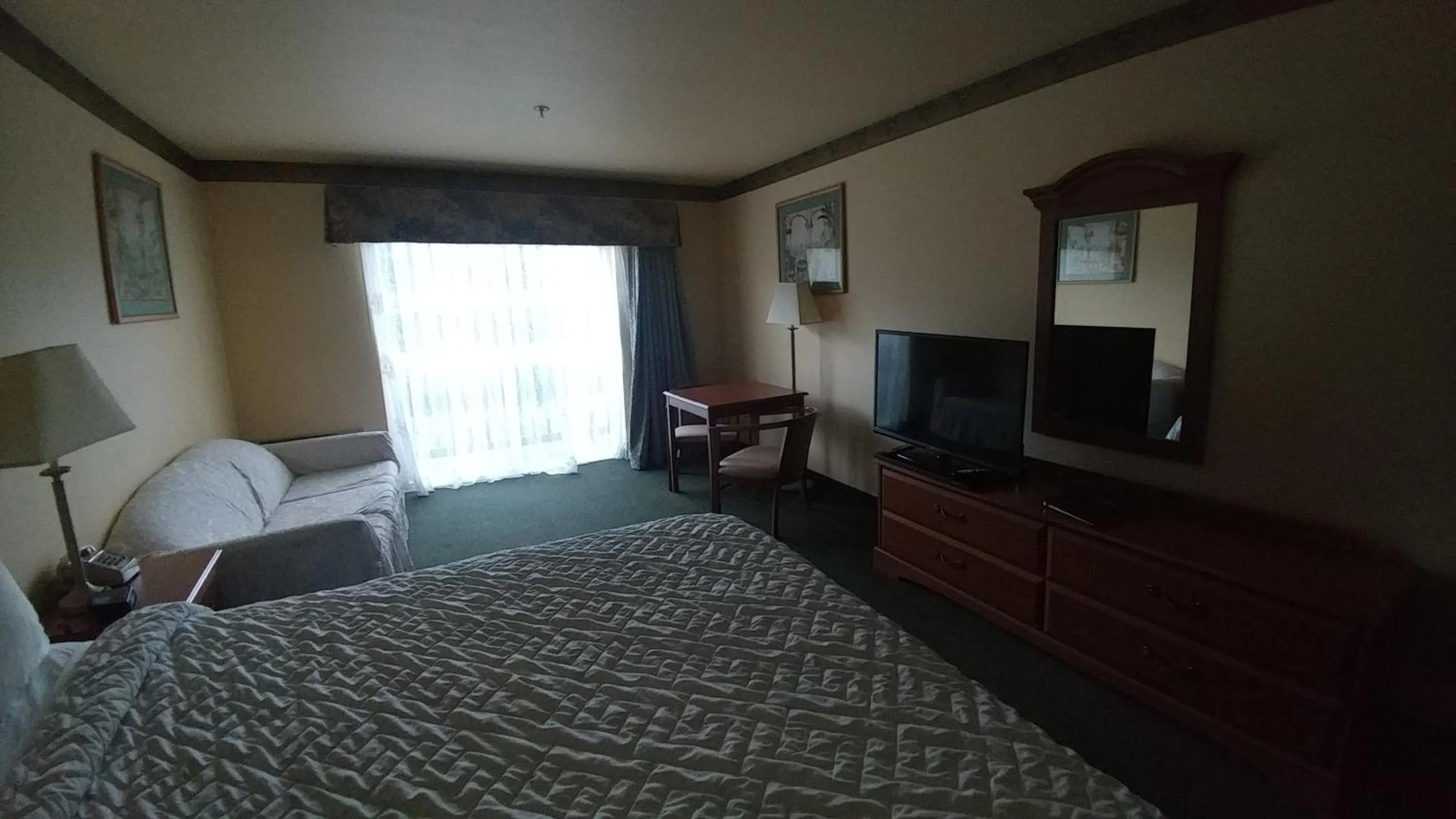 Bed in Palace Inn & Suites