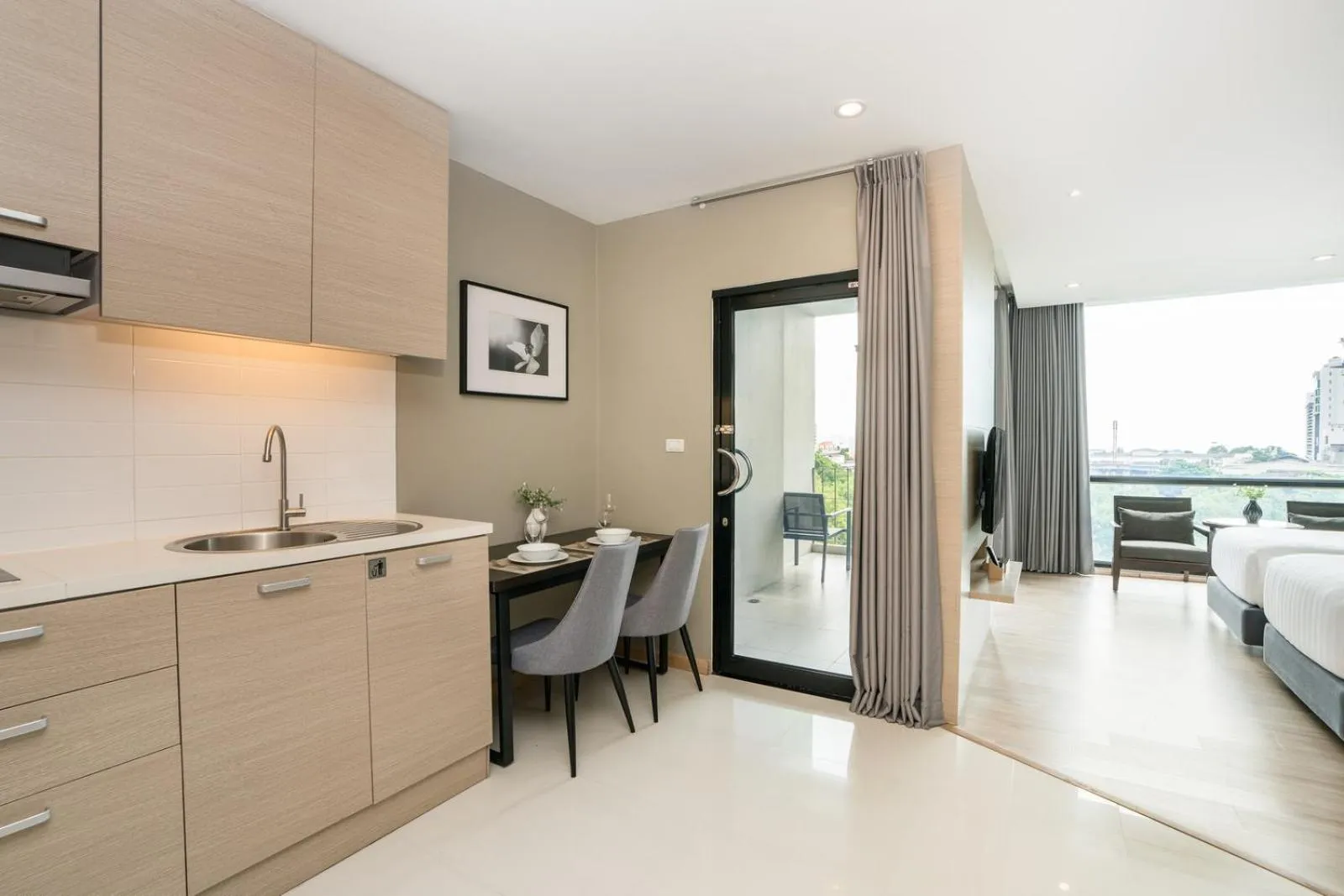 Kitchen or kitchenette, Bed in Altera Hotel and Residence by At Mind